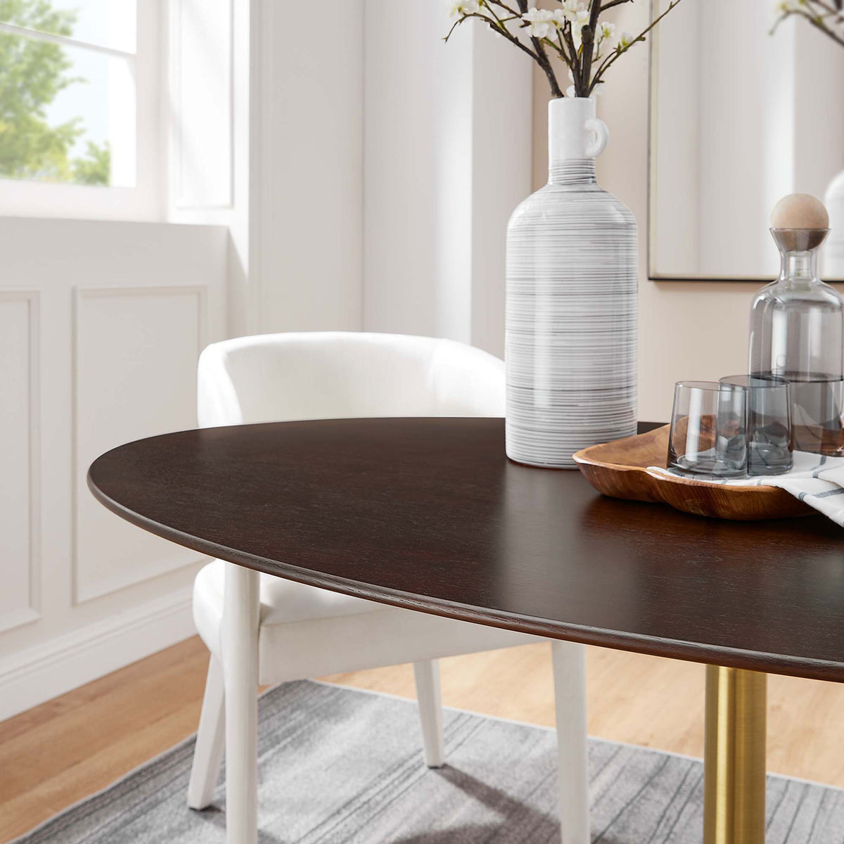 Walnut tabletop surface styled with neutral decor for a warm modern dining look || EEI-5524-GLD-CHE || detail_room