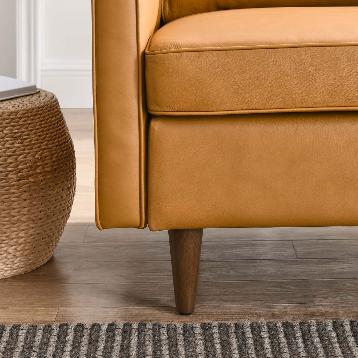 Walnut-stained tapered legs add mid-century character and stable support || EEI-5555-TAN || leg_room