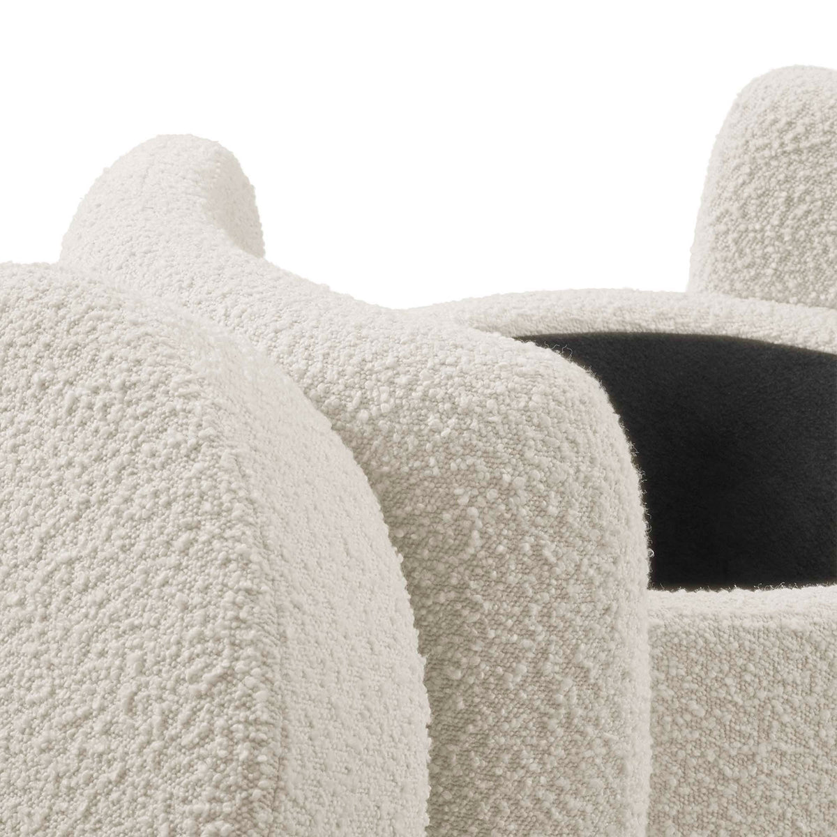 Ivory boucle upholstery with soft rounded edges and subtle seams on the ottoman frame || EEI-5561-IVO || detail_studio