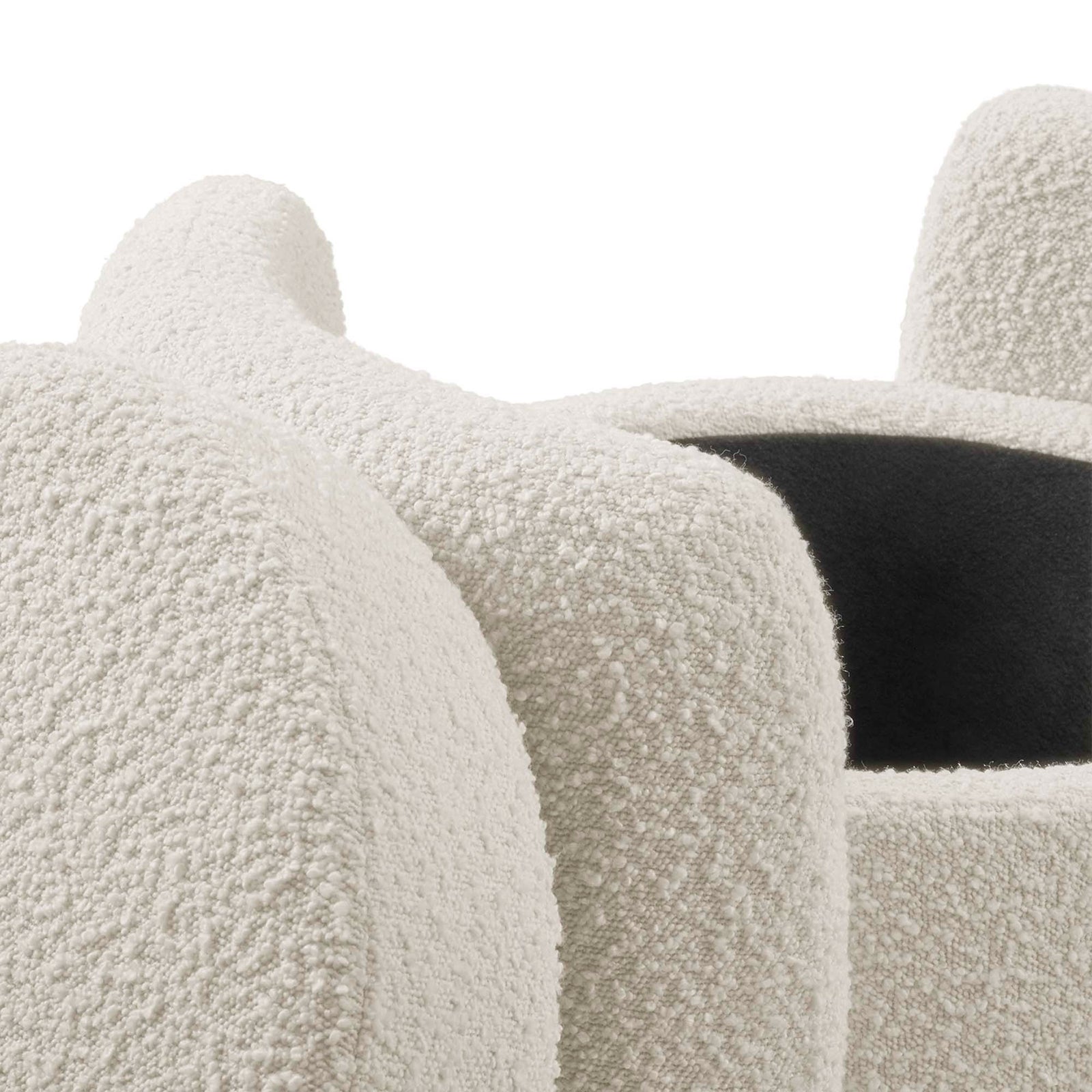 Ivory boucle upholstery with soft rounded edges and subtle seams on the ottoman frame || EEI-5561-IVO || detail_studio