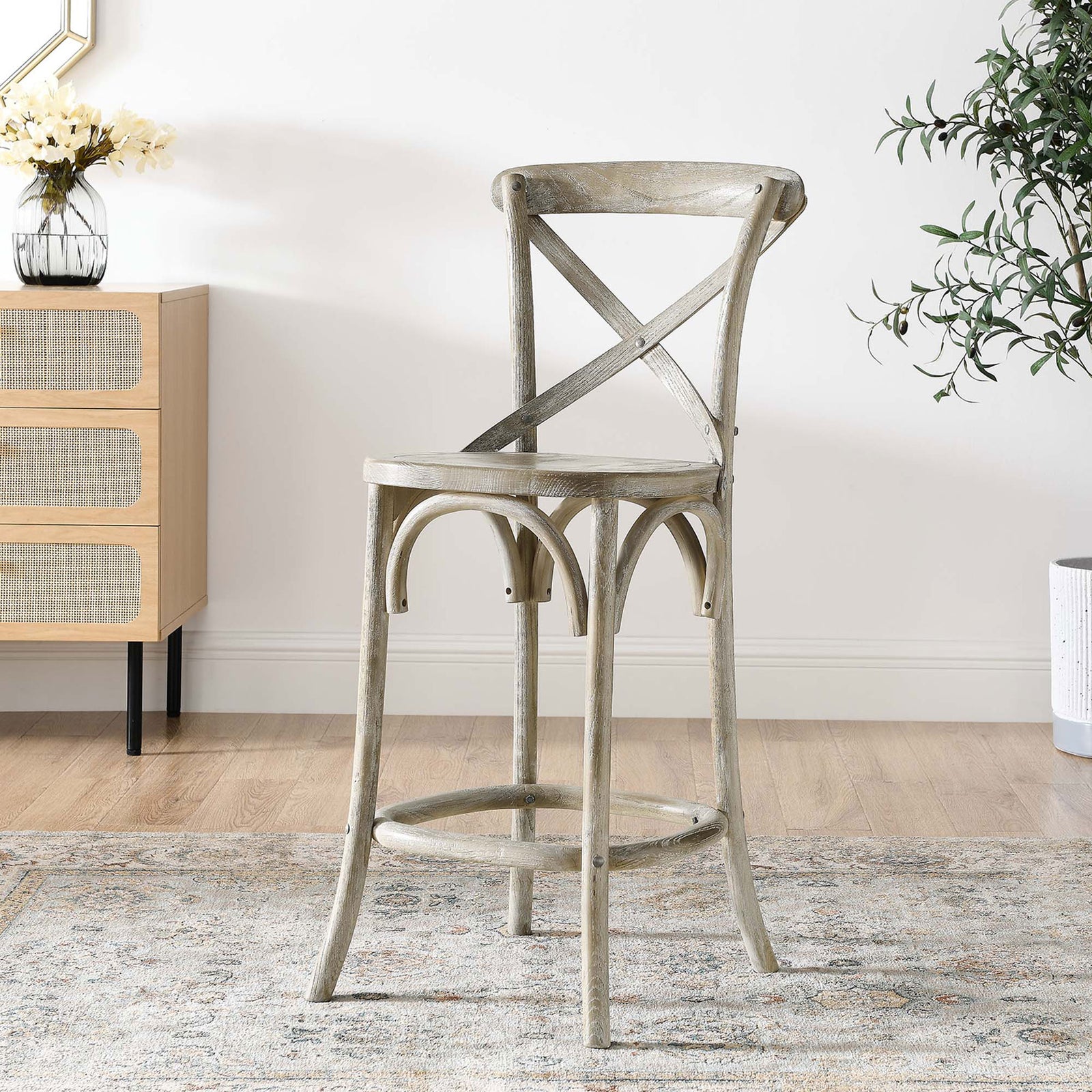 Versatile counter stool warms the room with a weathered gray finish and graceful arches. || EEI-5562-GRY || front_angle_room