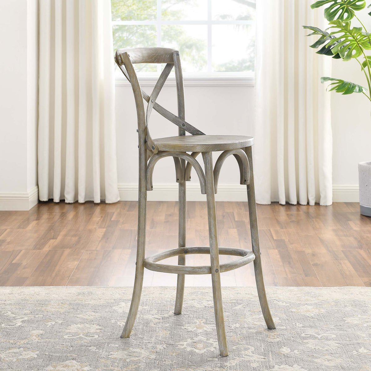 Bar stool lends an open, sculptural look with arched braces and slim legs. || EEI-5563-GRY || side_room