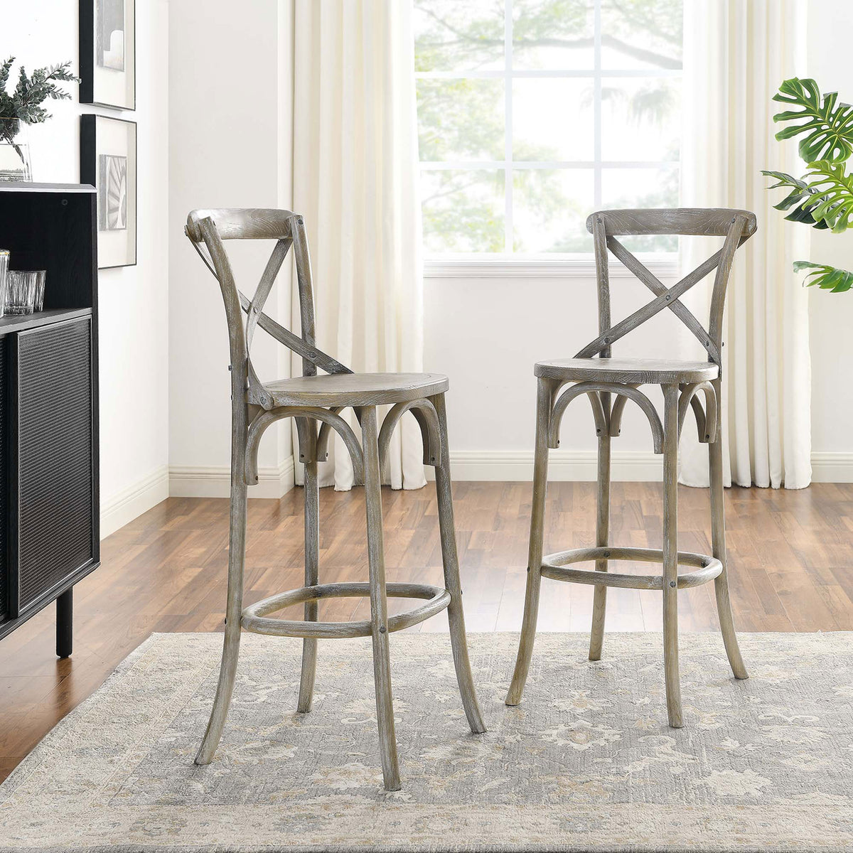 Paired bar stools showcase airy lines and a weathered gray finish. || EEI-5563-GRY || front_angle_room