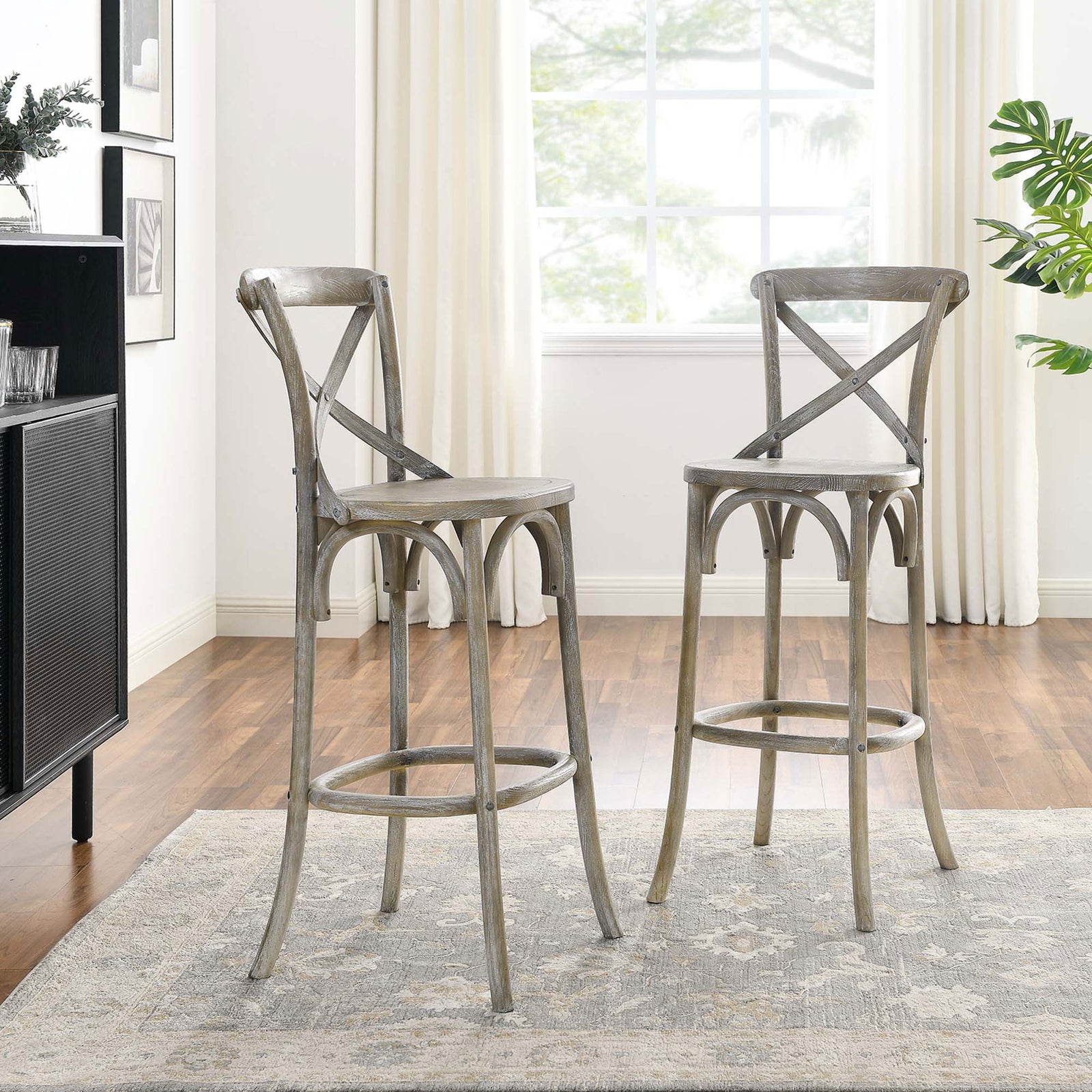 Paired bar stools showcase airy lines and a weathered gray finish. || EEI-5563-GRY || front_angle_room