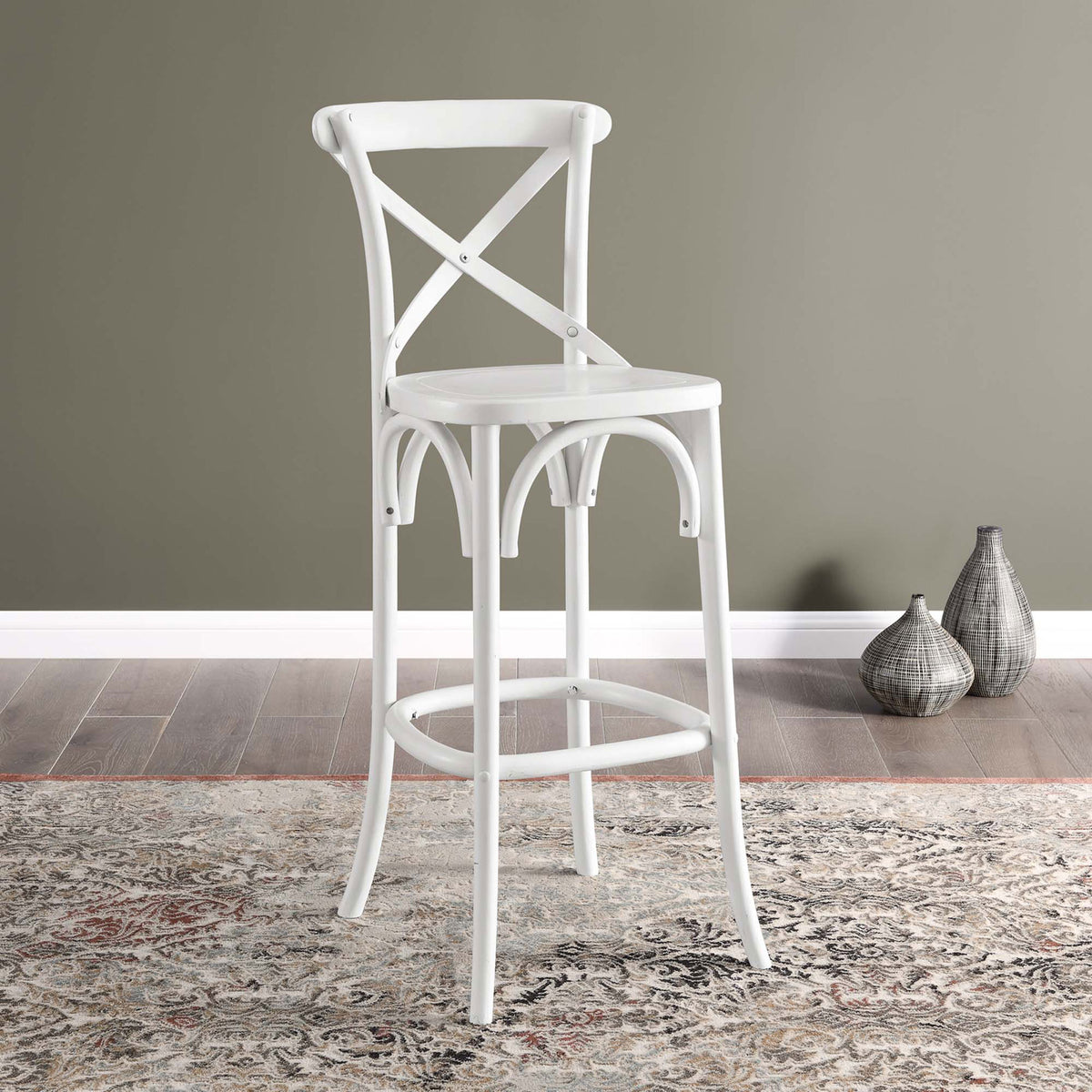 White bar stool brings fresh farmhouse style to dining areas with its X-back and curved supports || EEI-5563-WHI || front_angle_room