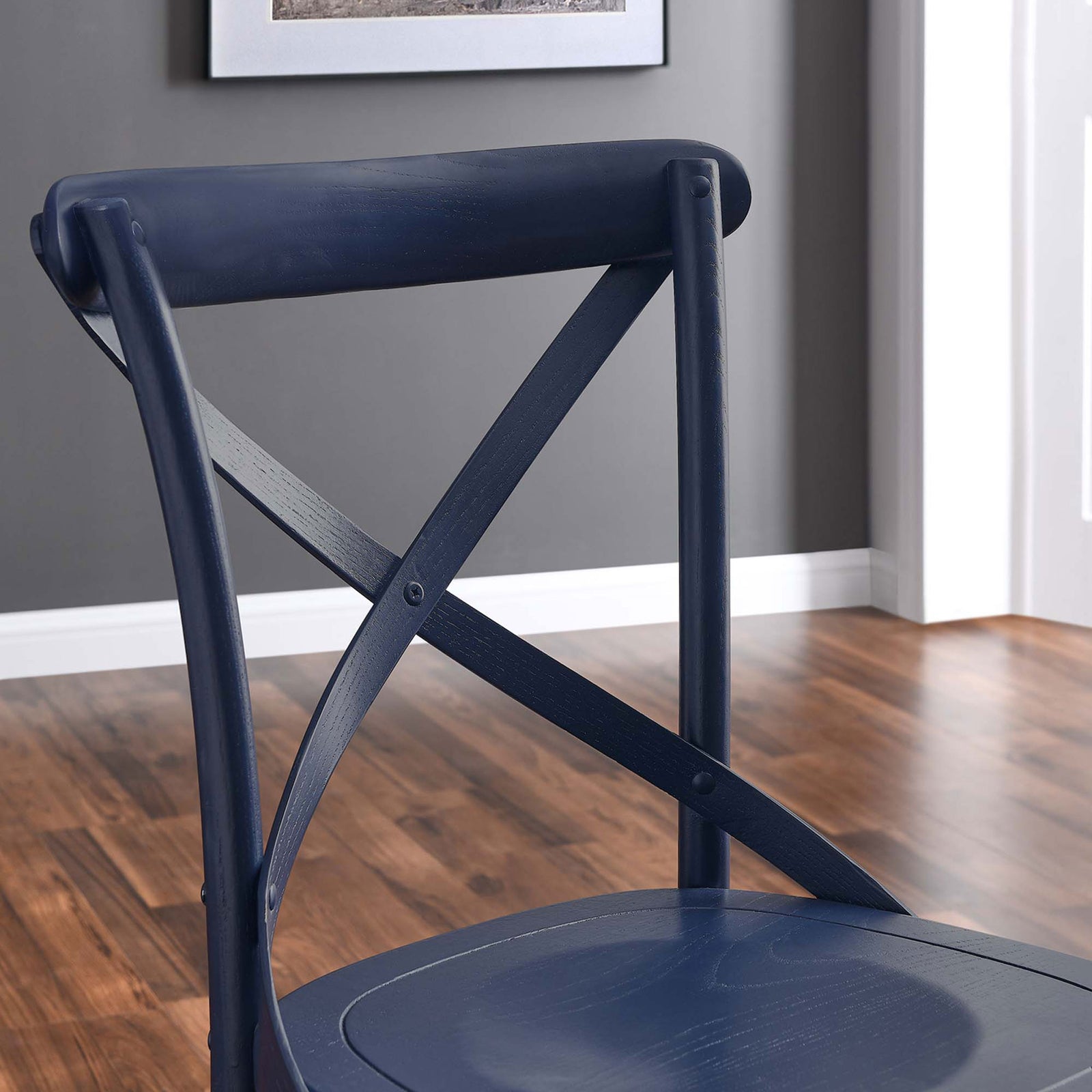 Close-up of the midnight blue chair back and X-brace detailing in a styled dining room || EEI-5564-MID || detail_room