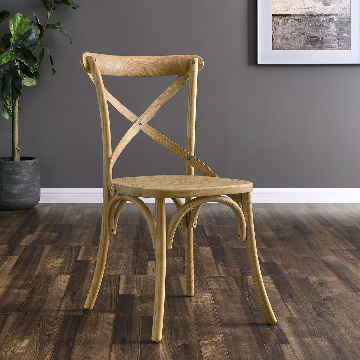 Natural cross-back dining chair styled in a modern room with wood flooring and wall art || EEI-5564-NAT || front_angle_room