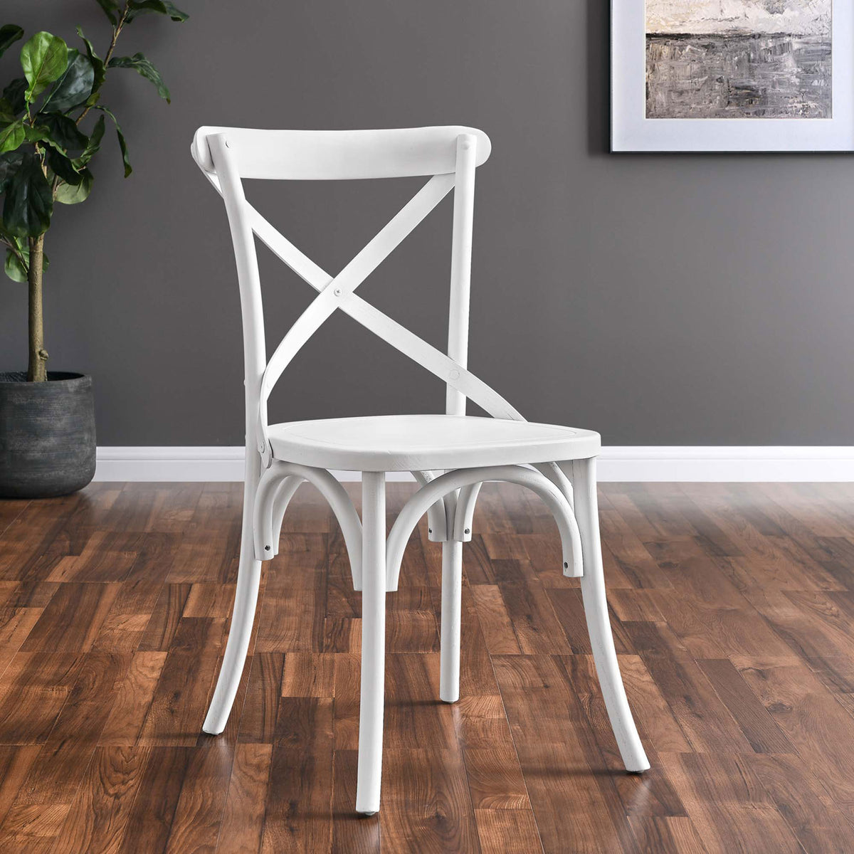 White farmhouse dining chair styled in a modern room with wood floors and artwork || EEI-5564-WHI || front_angle_room