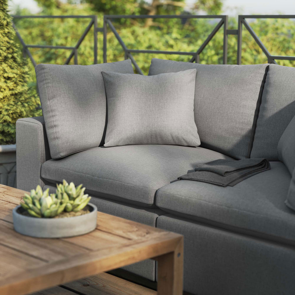 Charcoal patio loveseat styled with a wood coffee table and succulent planter on a sunny deck || EEI-5576-CHA || detail_room