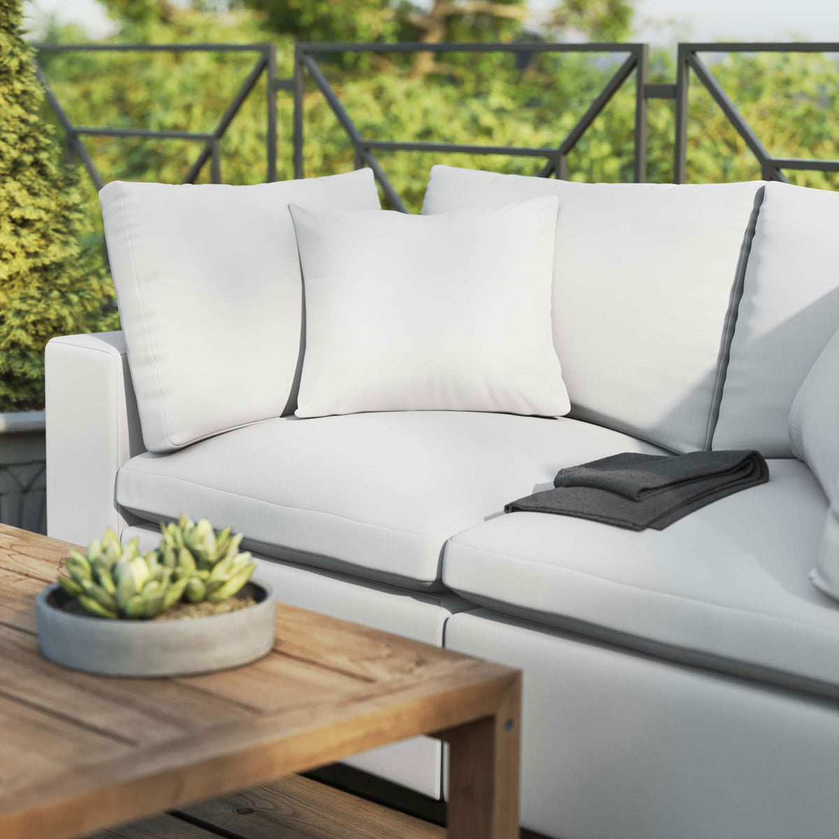 White patio loveseat paired with a wood coffee table and succulent centerpiece on an airy deck || EEI-5576-WHI || detail_room