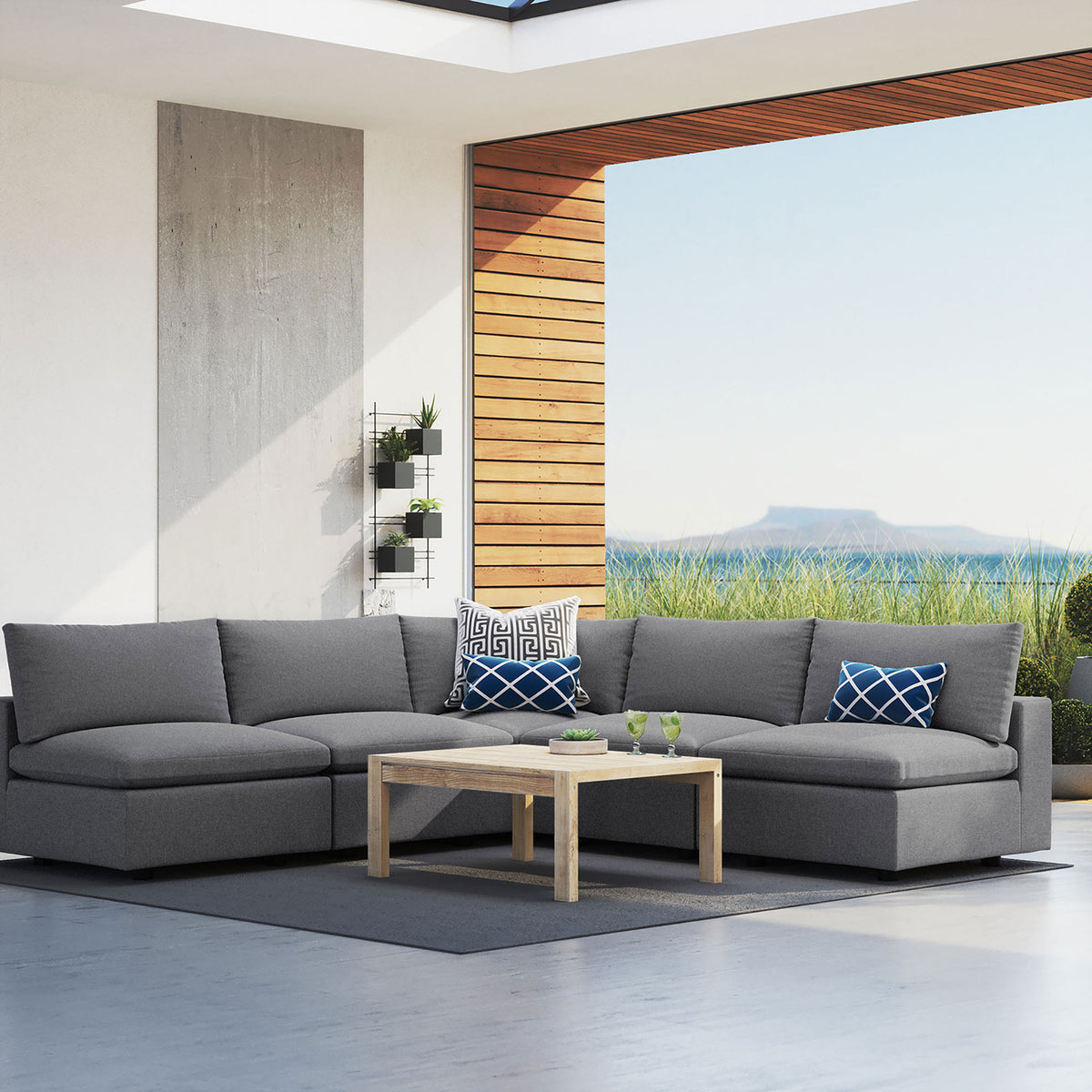 Gray Commix Sunbrella sectional creating a generous outdoor lounge with coastal-inspired views. || EEI-5588-SLA || front_angle_room