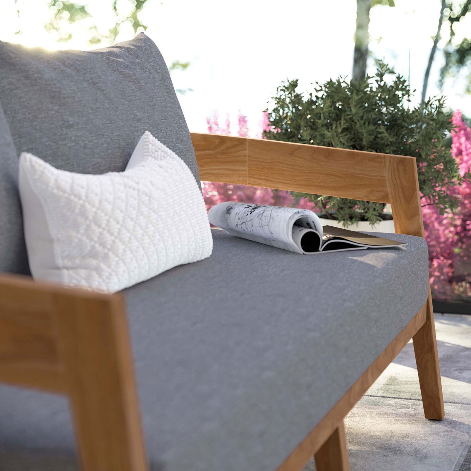 Gray seat cushions and teak arm detail add inviting comfort to this outdoor loveseat setting || EEI-5601-NAT-GRY || detail_room