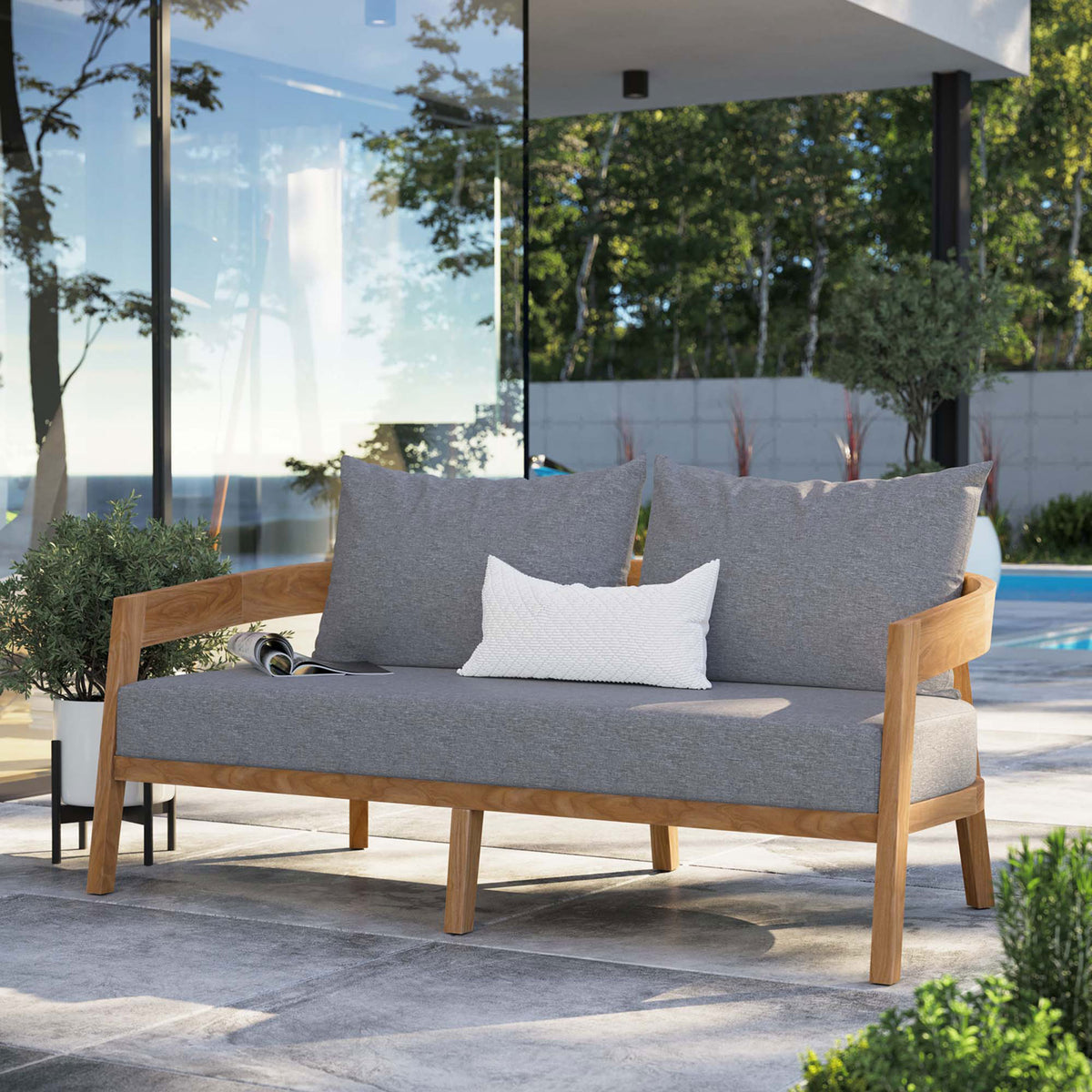 Gray cushioned teak loveseat creates a cozy gathering spot beside the pool on a modern patio || EEI-5601-NAT-GRY || front_angle_room
