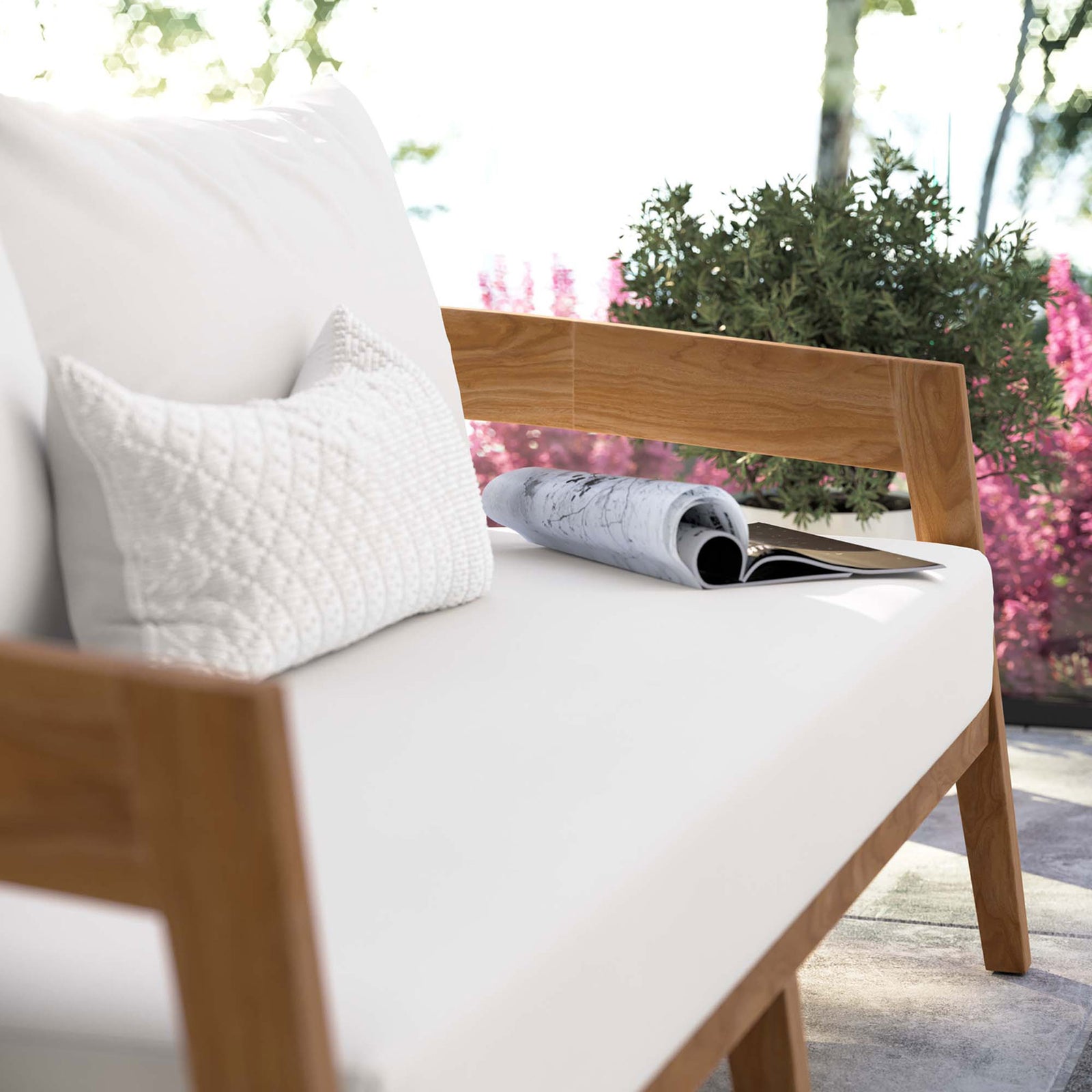 White seat cushions, accent pillow, and teak arm detail lend spa-like comfort to this patio loveseat || EEI-5601-NAT-WHI || detail_room