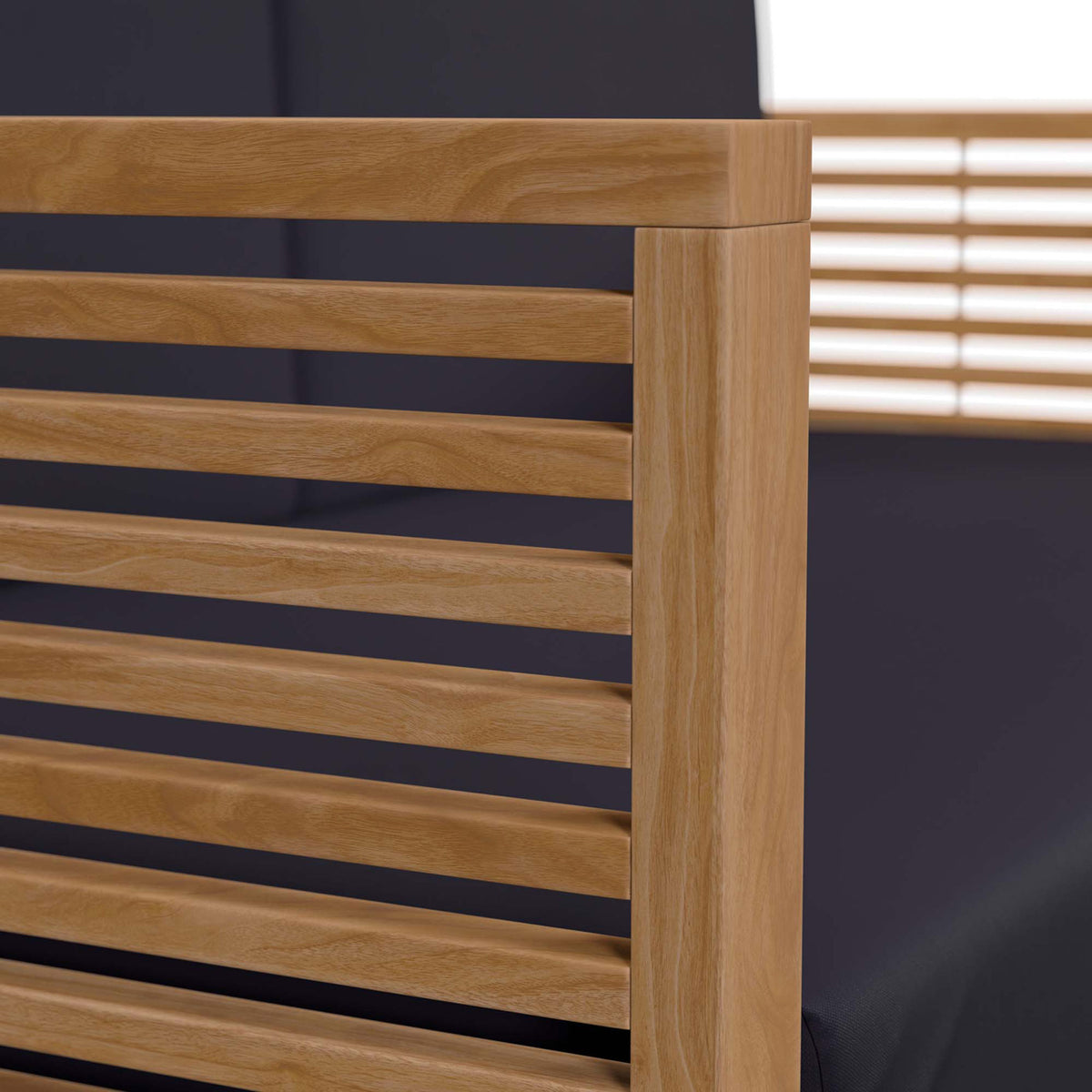 Close-up of the smooth teak armrest paired with a tailored navy cushion for a crisp contemporary look. || EEI-5605-NAT-NAV || detail_studio