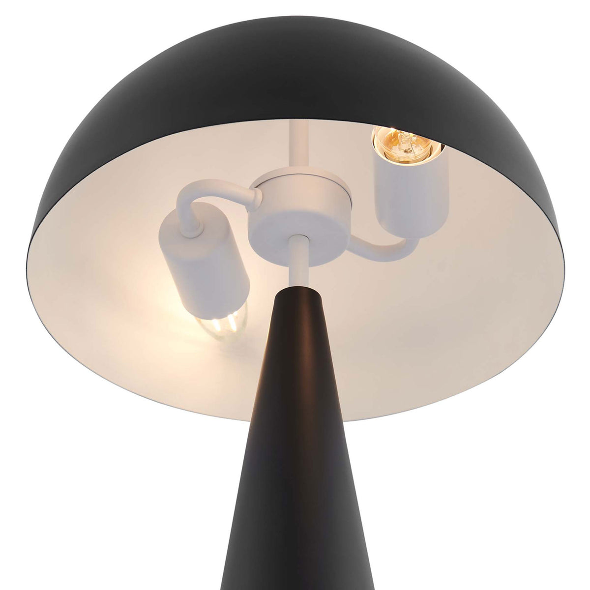 Twin bulbs beneath the dome shade cast a warm, inviting glow from the Selena lamp || EEI-5624-BLK || shade_on_studio