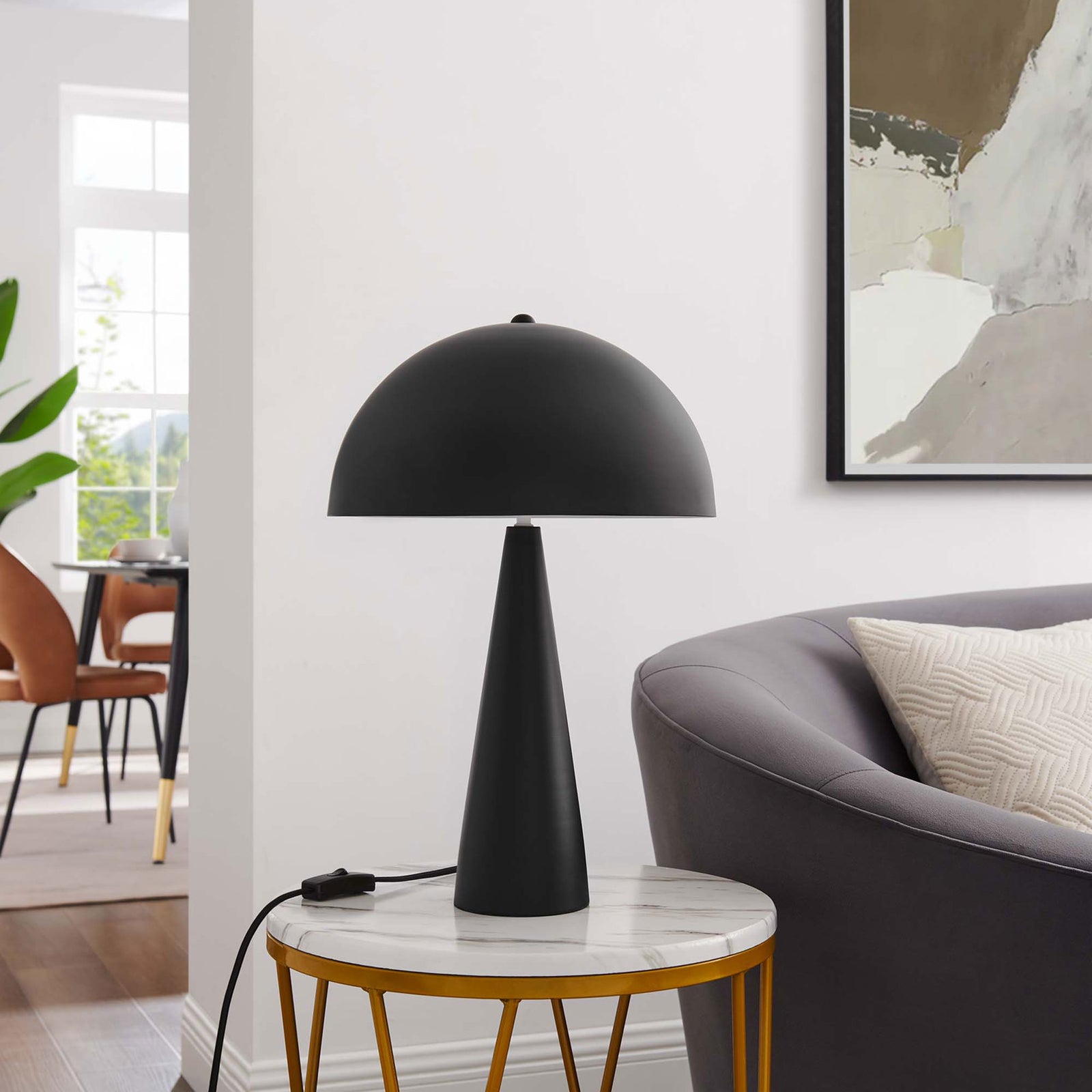 Black Selena lamp styled on a marble-topped side table beside a modern sofa in a bright room || EEI-5624-BLK || front_room