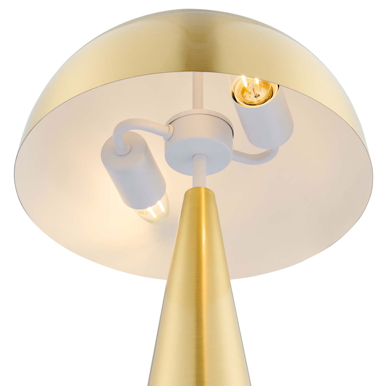 Twin bulbs beneath the dome shade glow inside the satin brass Selena table lamp || EEI-5624-SBR || shade_on_studio