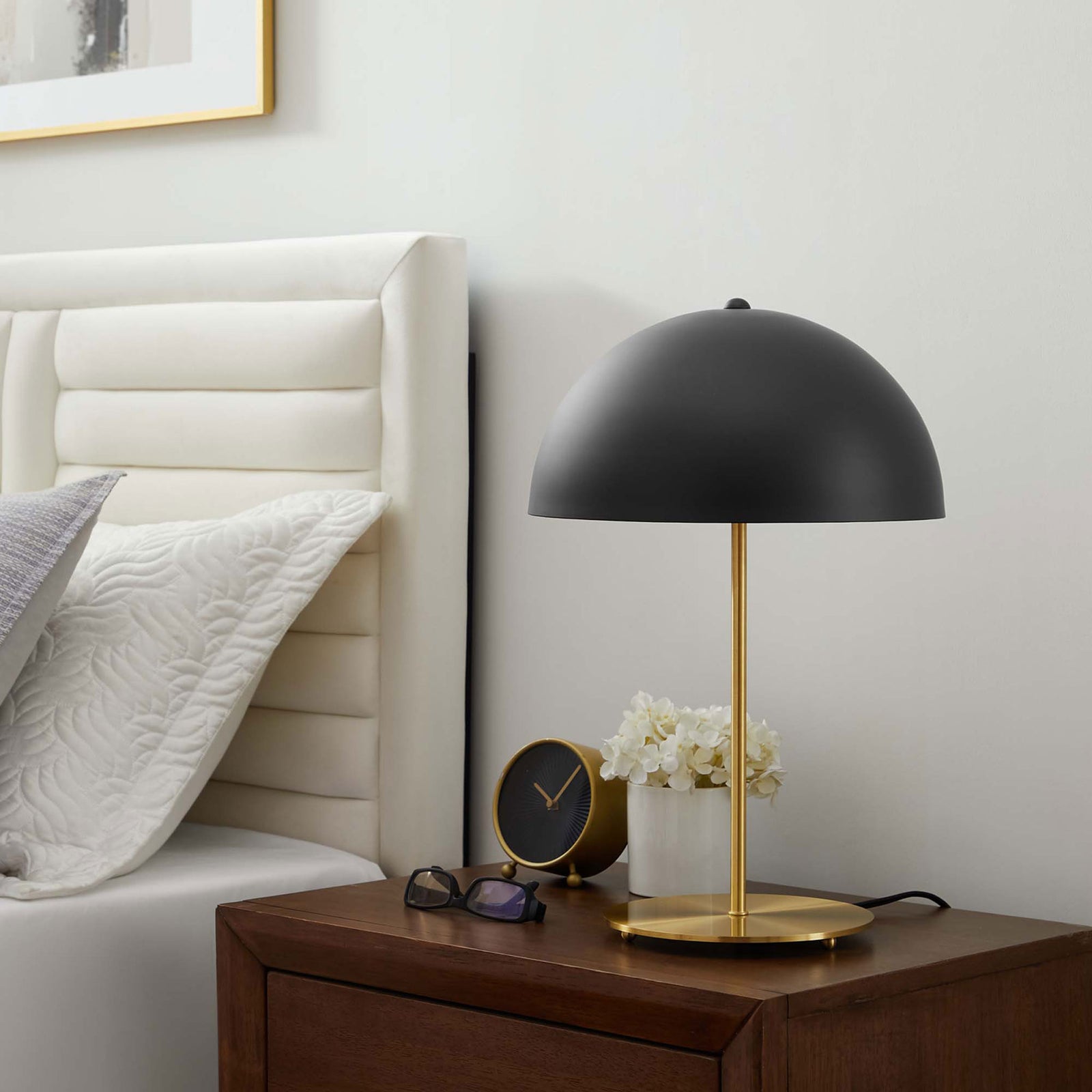 Black dome table lamp on a walnut nightstand adding sculptural contrast beside a tufted headboard || EEI-5629-BLK-SBR || front_angle_room