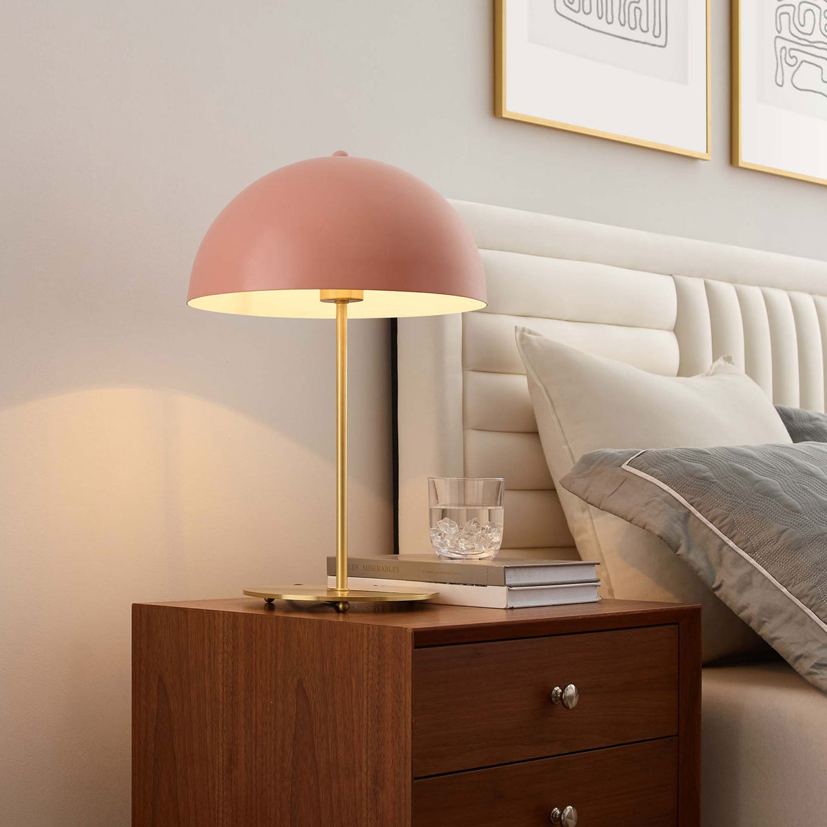 Pink dome lamp casting a warm bedside glow that softens the bedroom with golden light || EEI-5629-PNK-SBR || front_angle_on_room