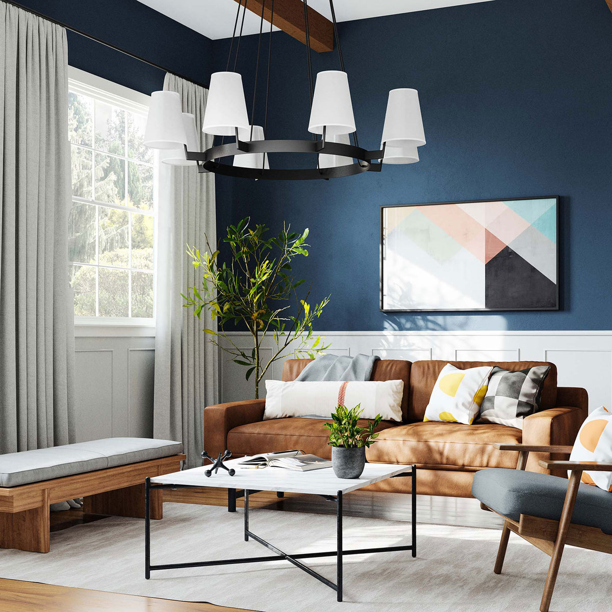 Create a welcoming focal point with this eight-light chandelier in a stylish living room || EEI-5641-WHI-BRZ || front_angle_room