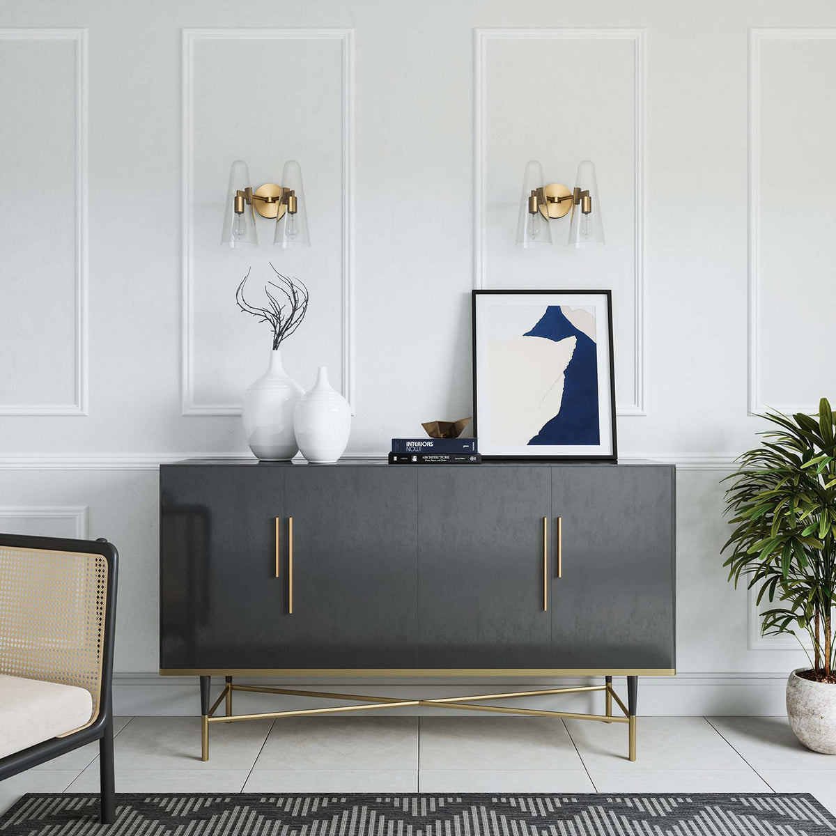 Pair of Beacon satin brass wall sconces with clear glass cones styled above a modern console || EEI-5646-CLR-SBR || front_room