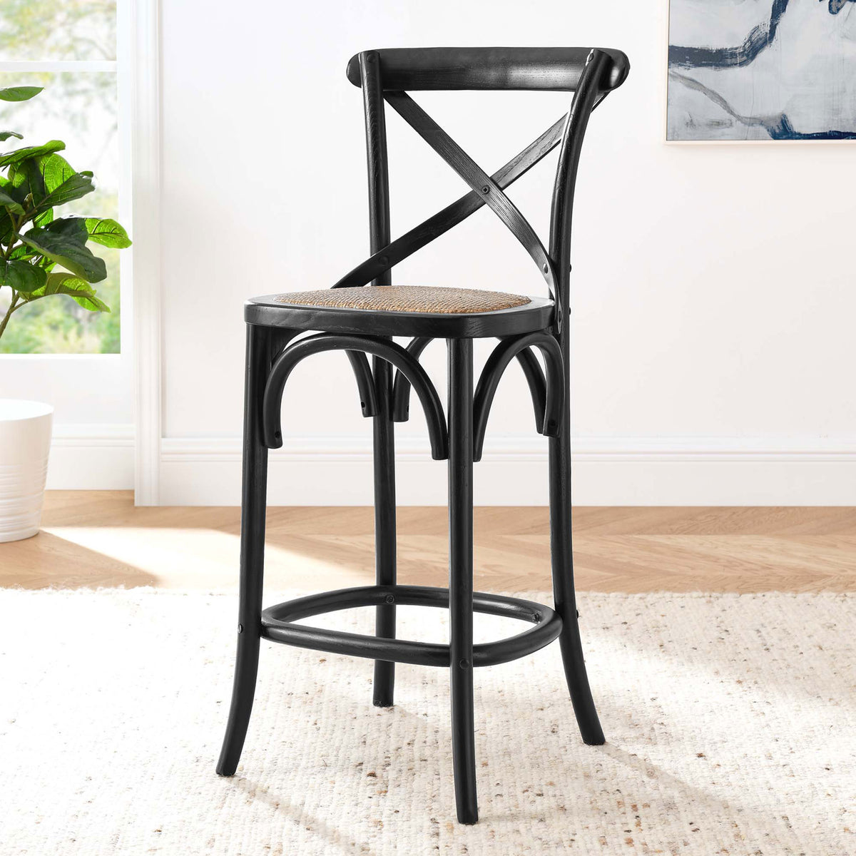 Counter stool elevates the kitchen with an X-brace back, rattan seat, and arched accents. || EEI-5667-BLK || front_angle_room