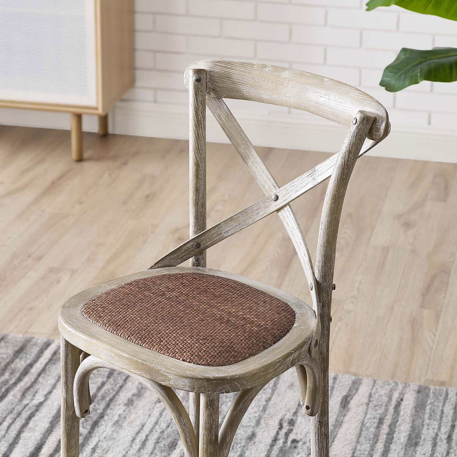 Weathered finish and X-brace detailing pair with a textured rattan seat for timeless farmhouse style || EEI-5667-GRY || detail_room