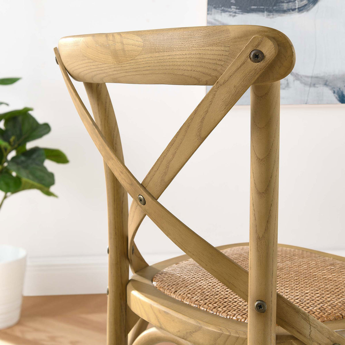 Smooth-finished X-brace back shows the artisan wood grain of the counter stool. || EEI-5667-NAT || detail_room