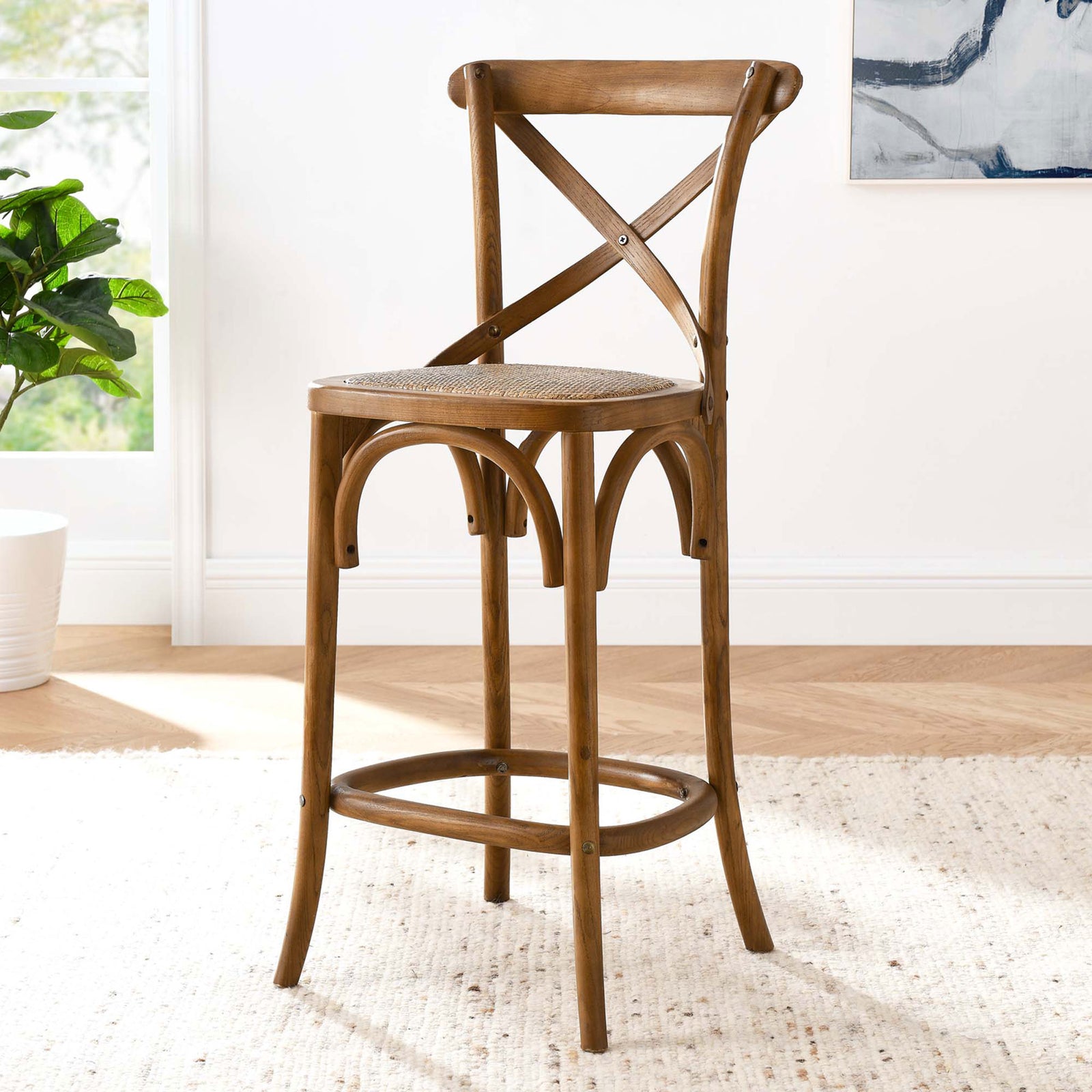 Versatile counter stool silhouette highlights airy rattan seat and elm wood build || EEI-5667-WAL || front_angle_room
