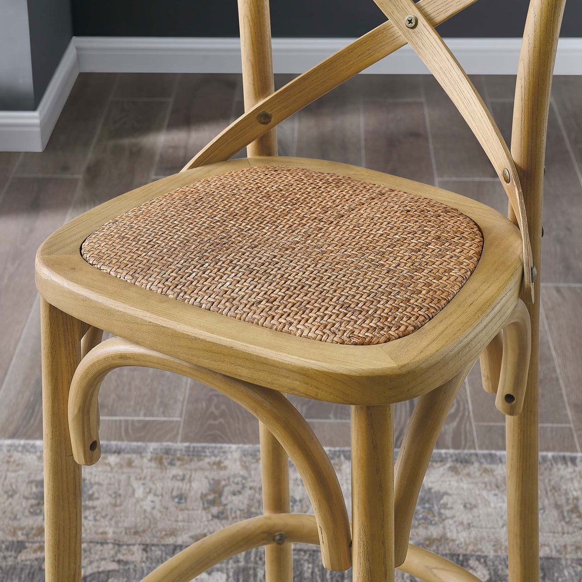 Artisan rattan seat and smooth wood finish add inviting texture to the bar stool. || EEI-5668-NAT || detail_room