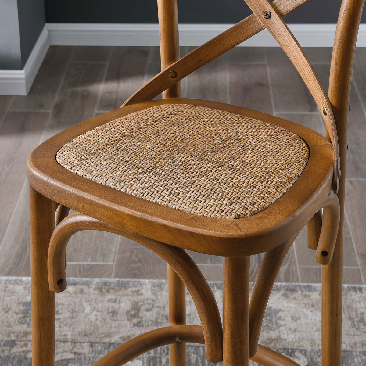 Woven rattan seat and warm walnut finish lend organic texture to the bar || EEI-5668-WAL || detail_room