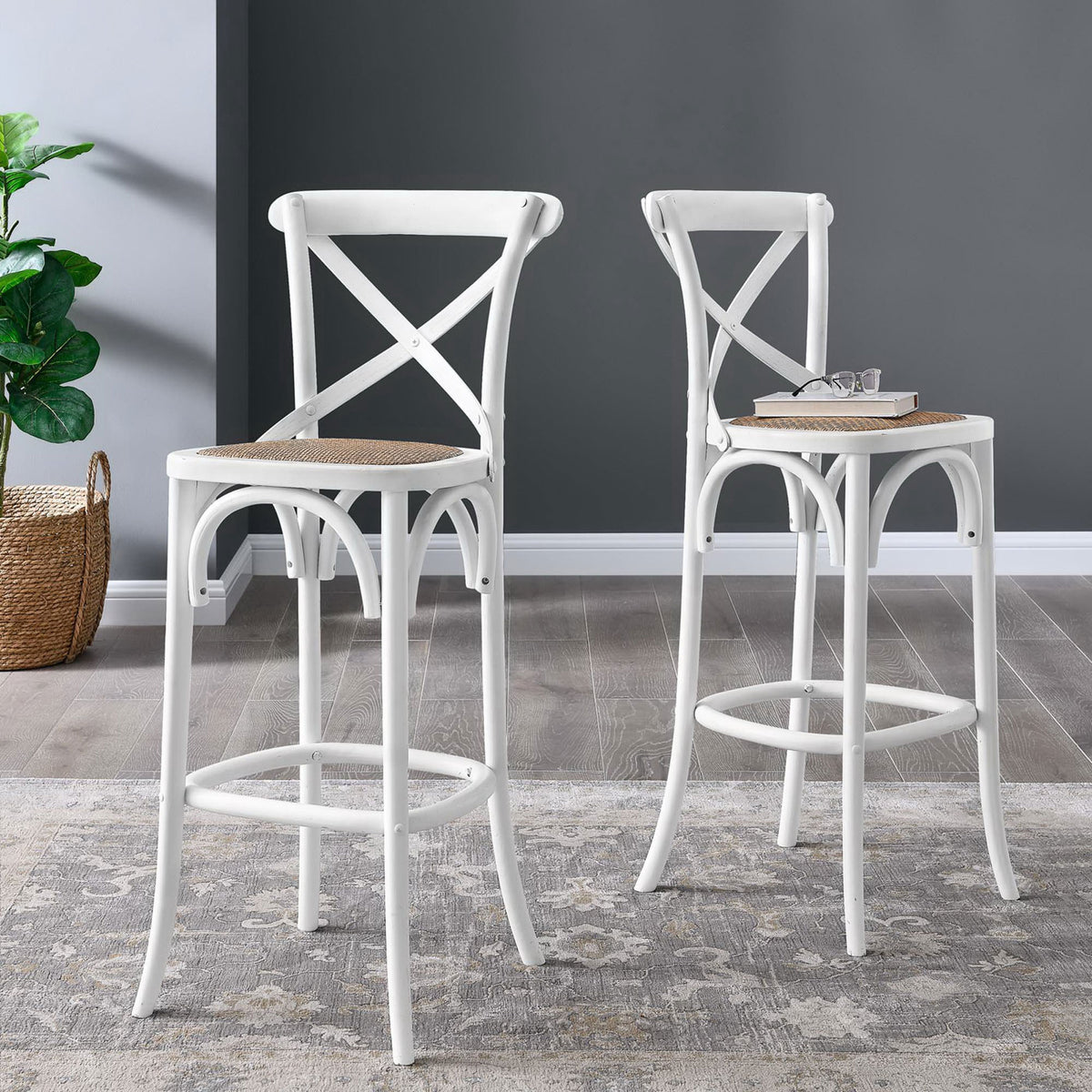White bar stool showcases a woven seat and sculpted footrest for relaxed seating. || EEI-5668-WHI || front_angle_room