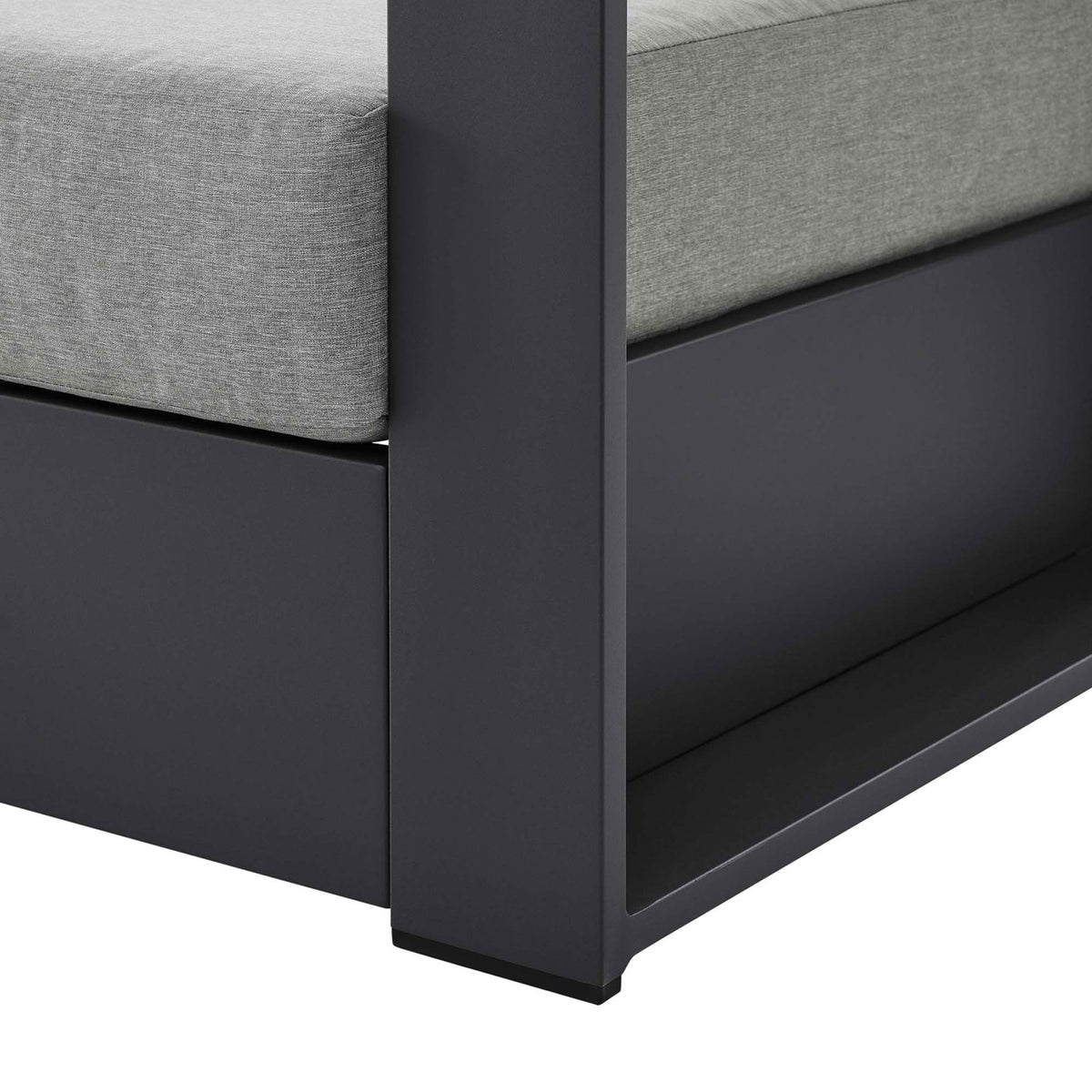 Detail of Tahoe armchair leg showing clean-lined charcoal aluminum base with protective foot glides || EEI-5675-GRY-GRY || leg_studio