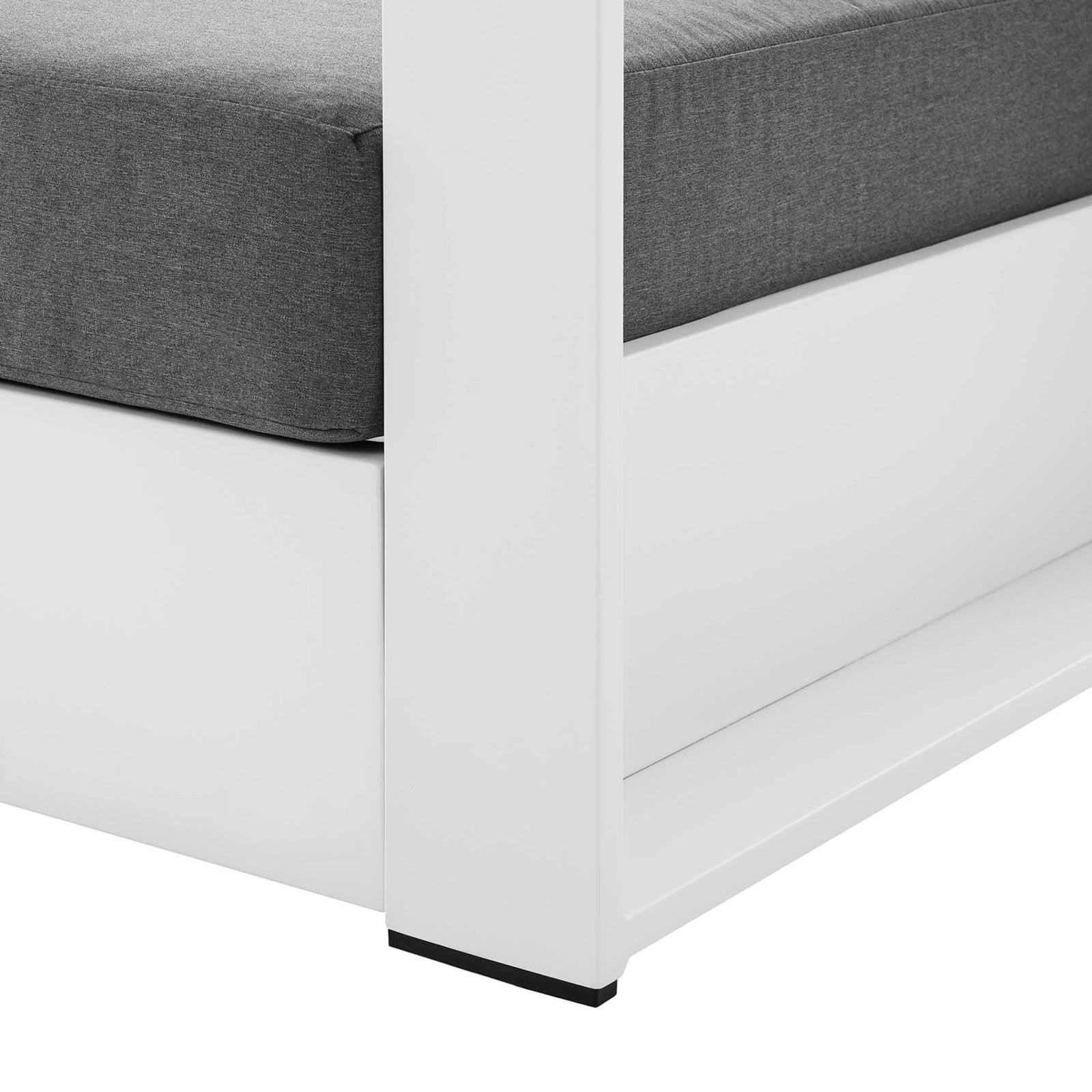Detail of Tahoe armchair leg showing smooth white aluminum base with protective foot glides || EEI-5675-WHI-CHA || leg_studio