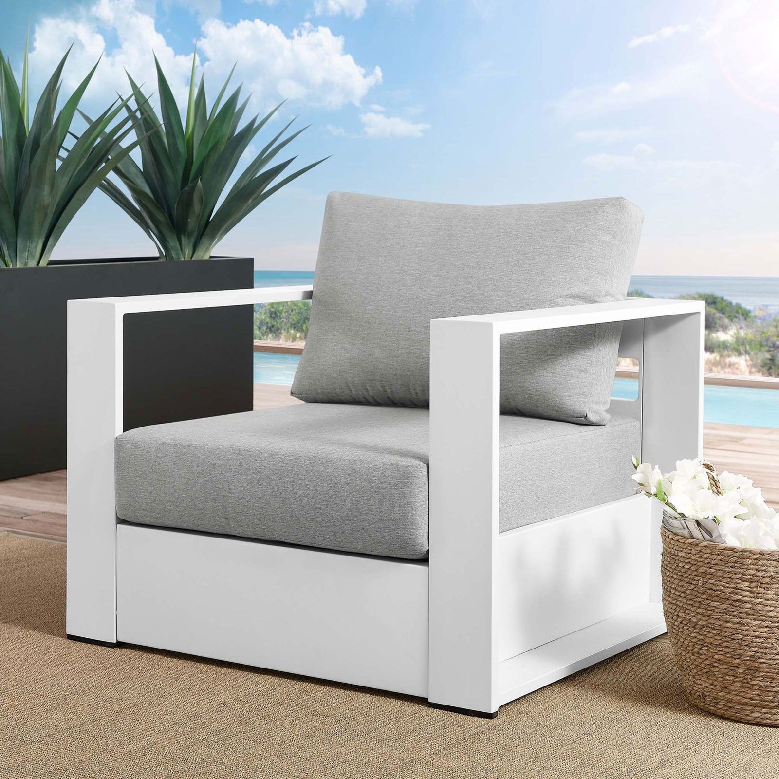 Tahoe white aluminum outdoor armchair with light gray cushions styled on a contemporary poolside deck || EEI-5675-WHI-GRY || front_angle_room