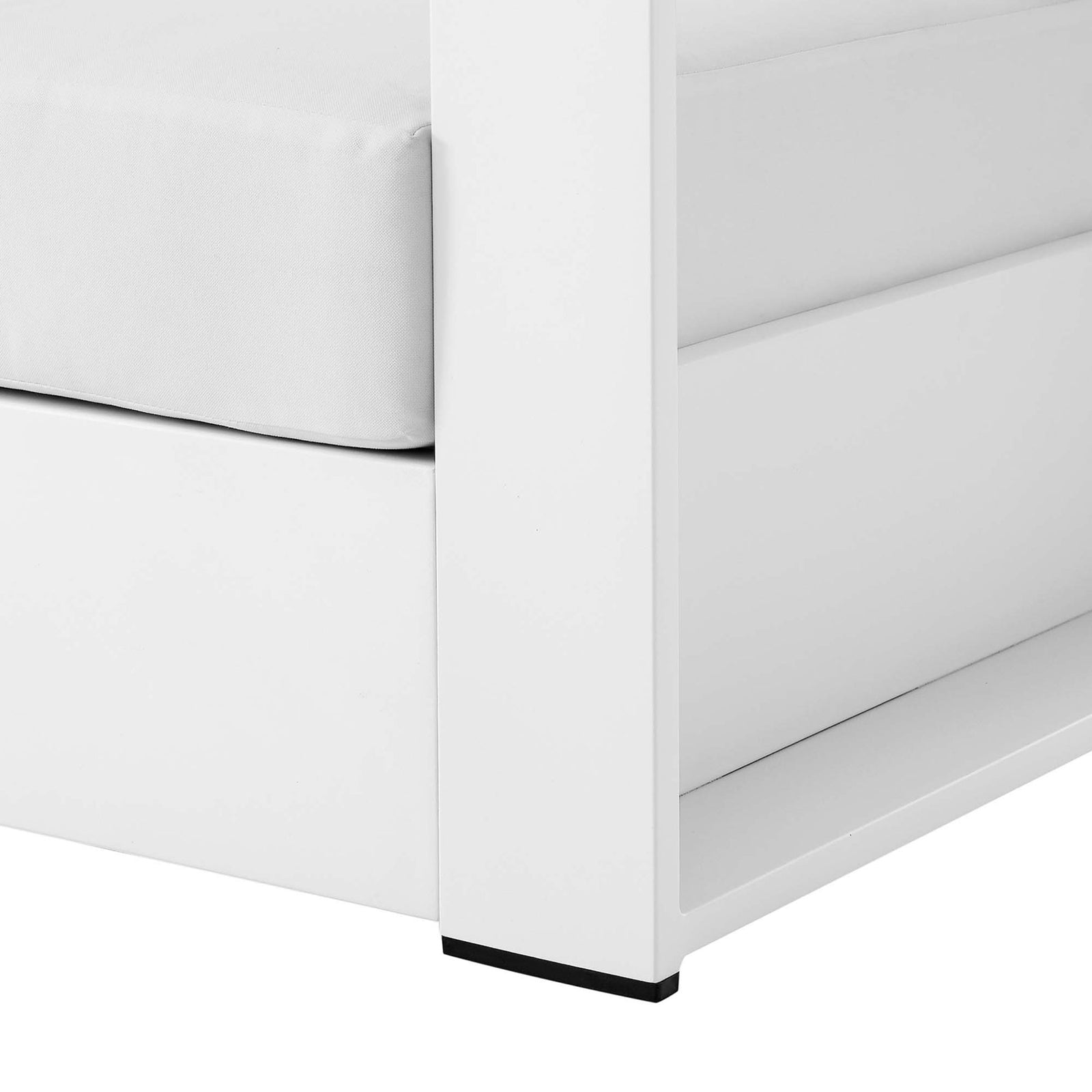 Detail of Tahoe armchair leg showing smooth white aluminum base with protective foot glides || EEI-5675-WHI-WHI || leg_studio