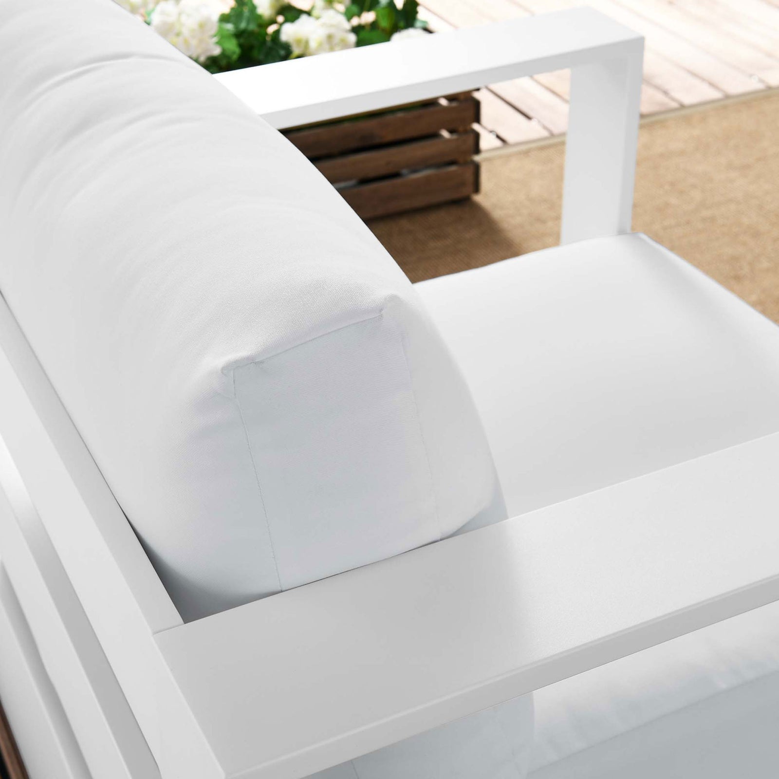 Tahoe armchair back cushion and armrest styled outdoors with soft white upholstery and sleek frame || EEI-5675-WHI-WHI || detail_room