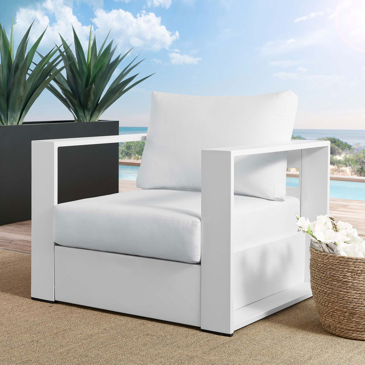 Tahoe white aluminum outdoor armchair with white cushions arranged on a bright poolside deck || EEI-5675-WHI-WHI || front_angle_room