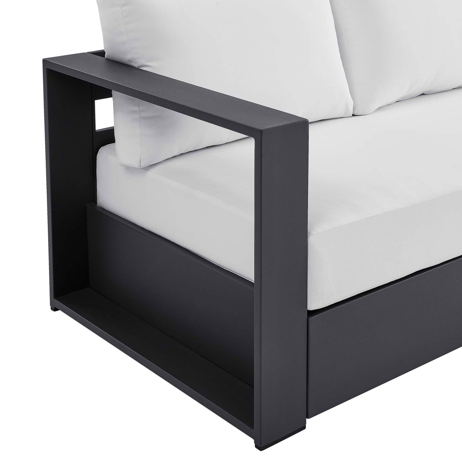 Detail of the Tahoe sofa arm shelf, featuring a matte charcoal finish and smooth cushion seams. || EEI-5676-GRY-WHI || detail_studio