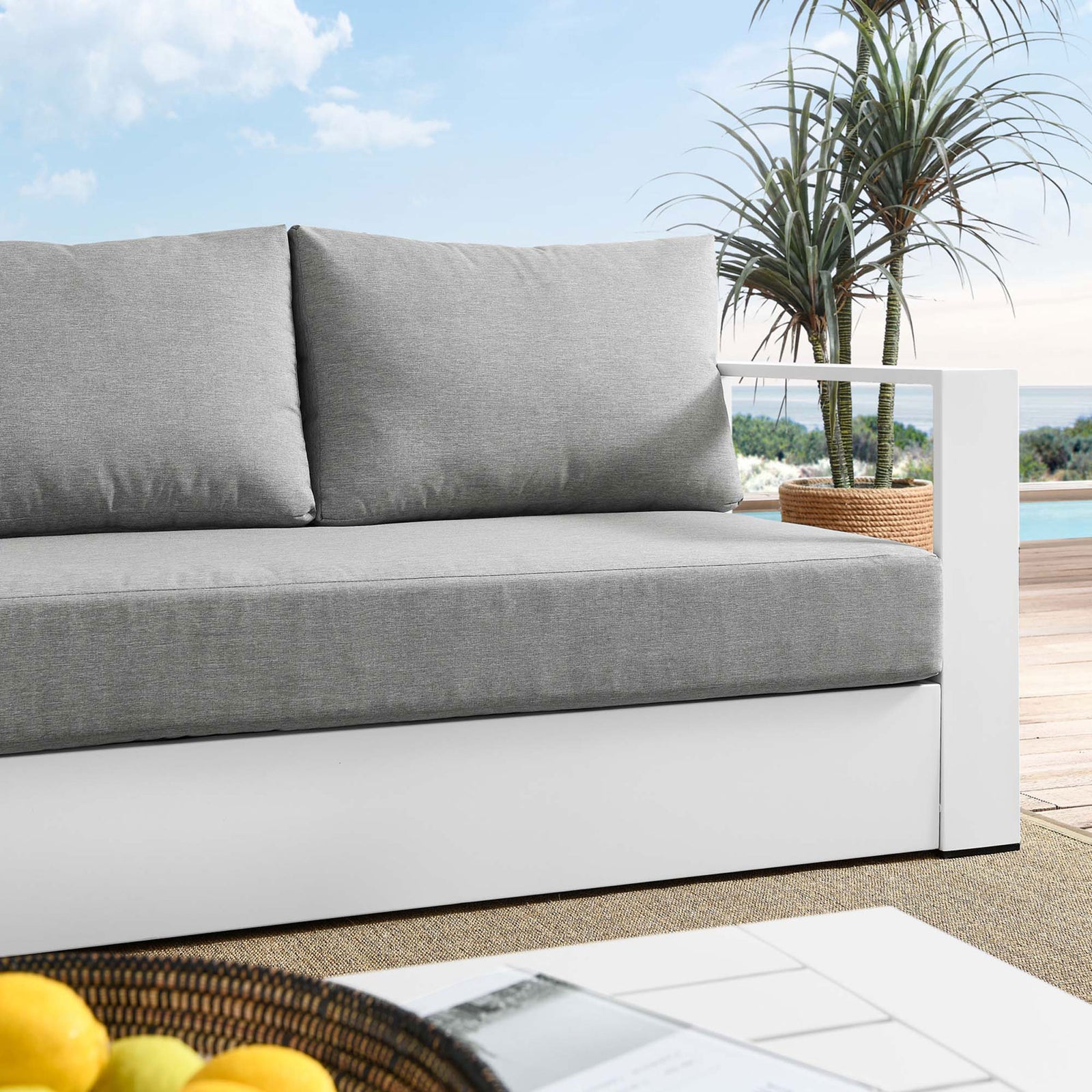 Close lifestyle view of the Tahoe sofa highlighting textured gray cushions against the white frame. || EEI-5676-WHI-GRY || detail_room