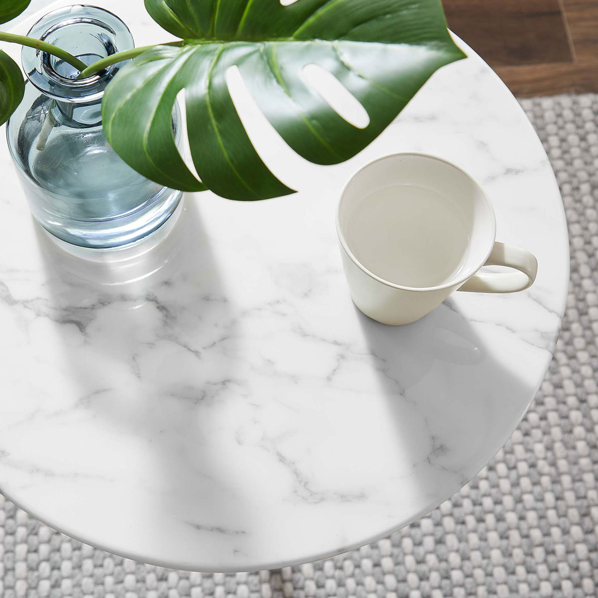 Faux marble tabletop styled with greenery, a glass vase, and mug to showcase the table's smooth easy-clean surface || EEI-5685-GLD-WHI || detail_room