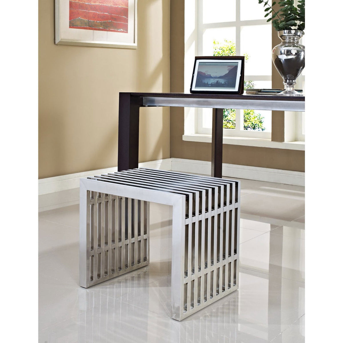 Stainless steel bench adds modern shine beneath a desk in a bright, contemporary workspace || EEI-569-SLV || front_angle_room