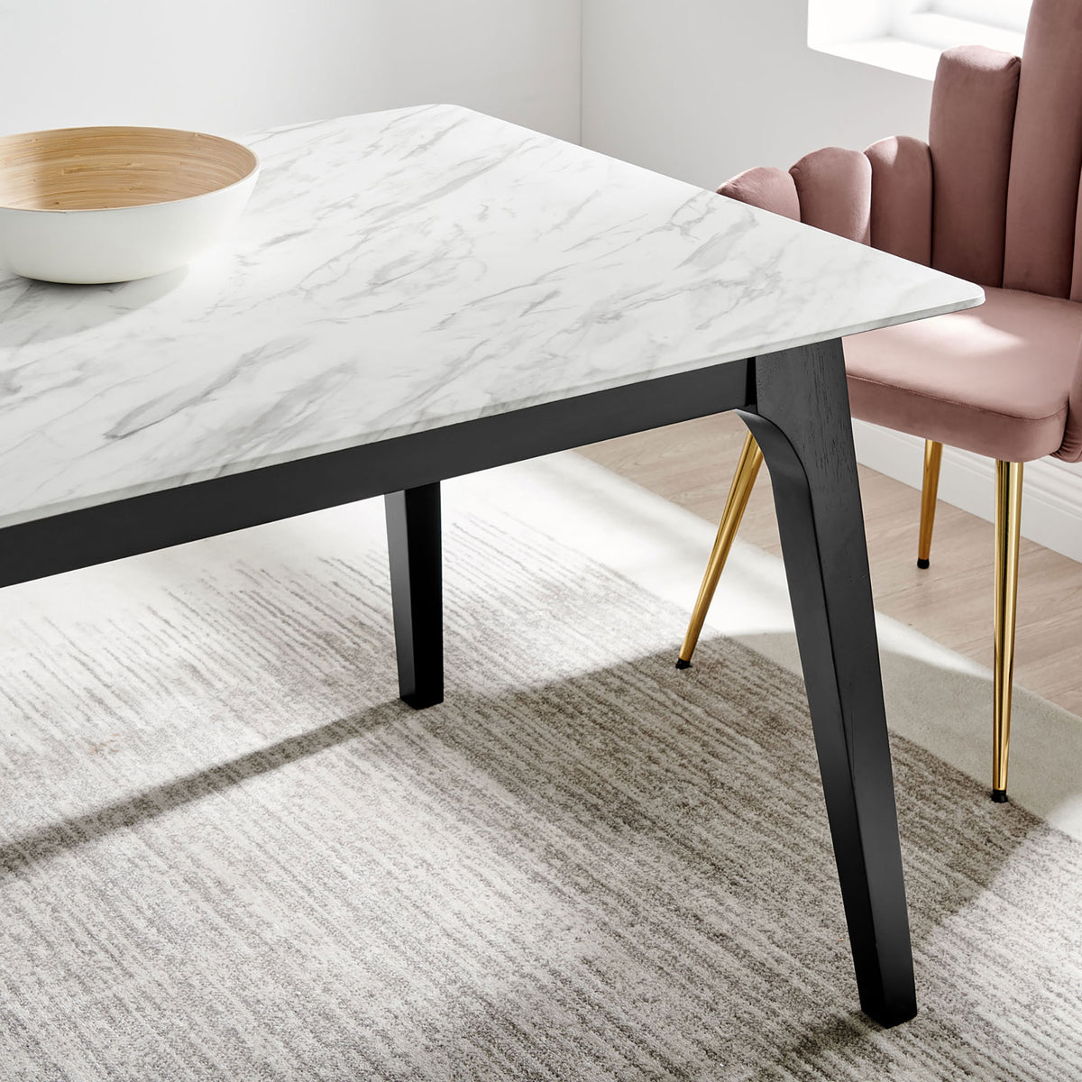 Marble tabletop and black leg create a refined contrast in a bright modern dining room || EEI-5693-BLK-WHI || detail_room