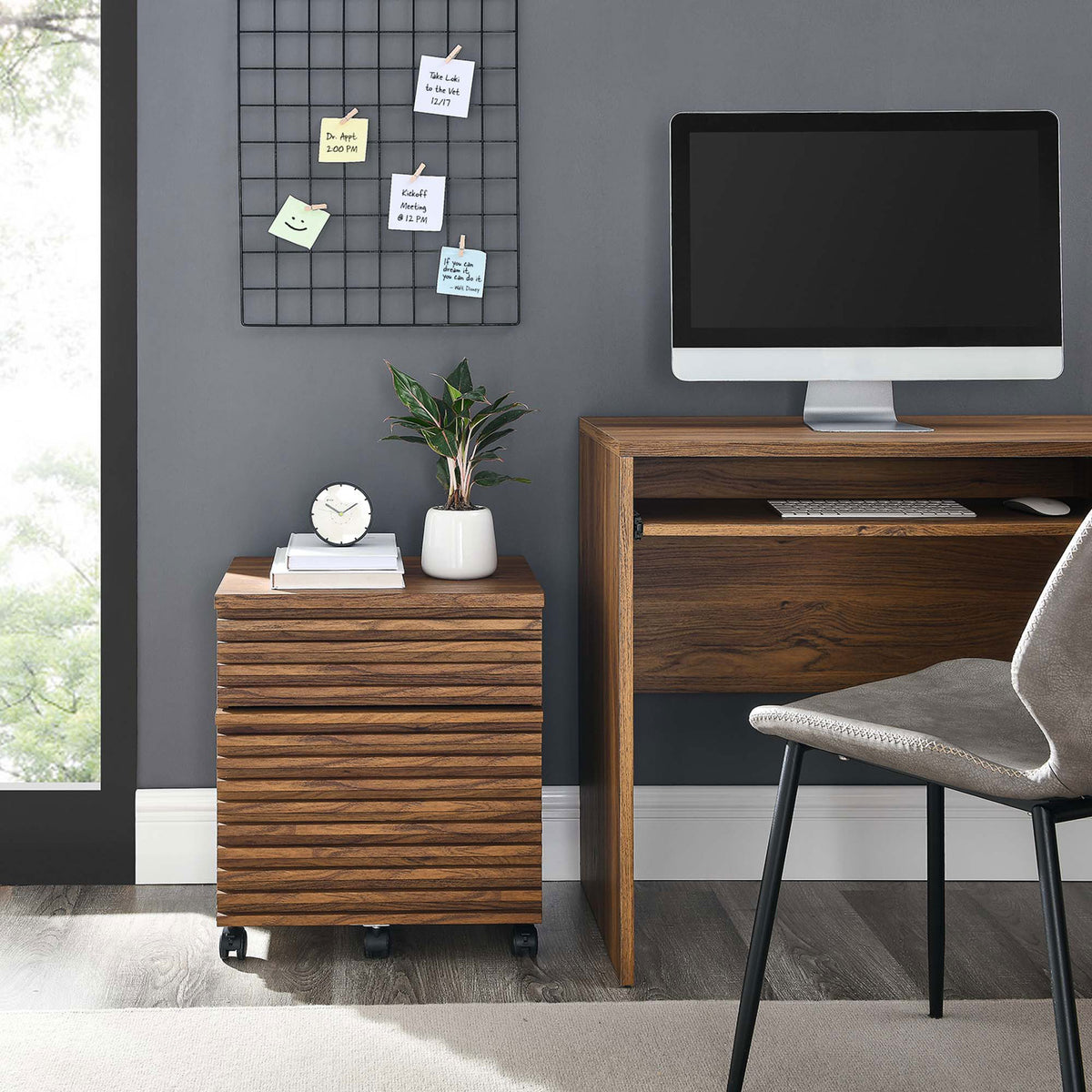 Walnut rolling file cabinet tucked under modern desk, adding warm mid-century storage to the workspace || EEI-5704-WAL || front_angle_room