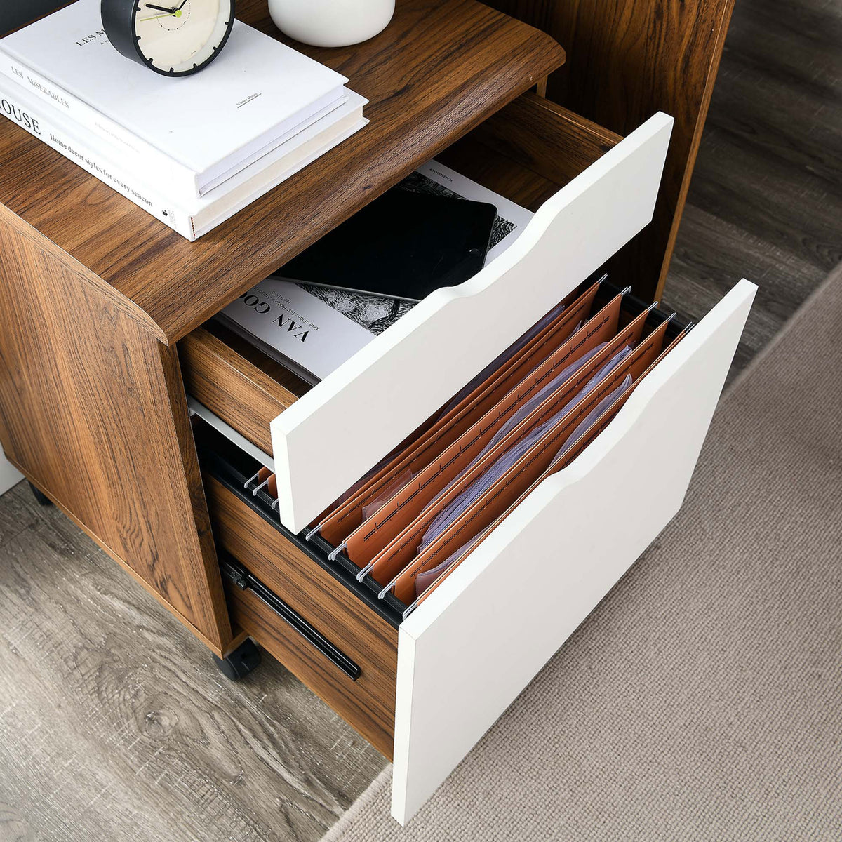 File cabinet in a home office setting with lower drawer open, keeping hanging folders neat and accessible. || EEI-5706-WAL-WHI || storage_open_room