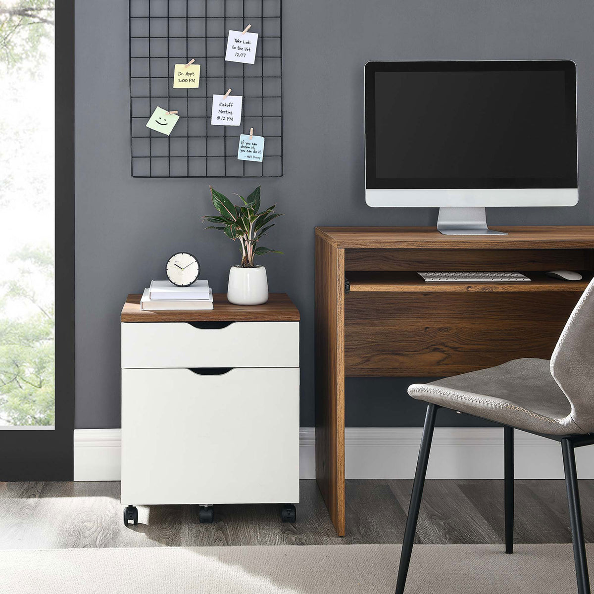 Compact rolling file cabinet in walnut and white finish tucks neatly beside a desk to maximize workspace. || EEI-5706-WAL-WHI || front_room