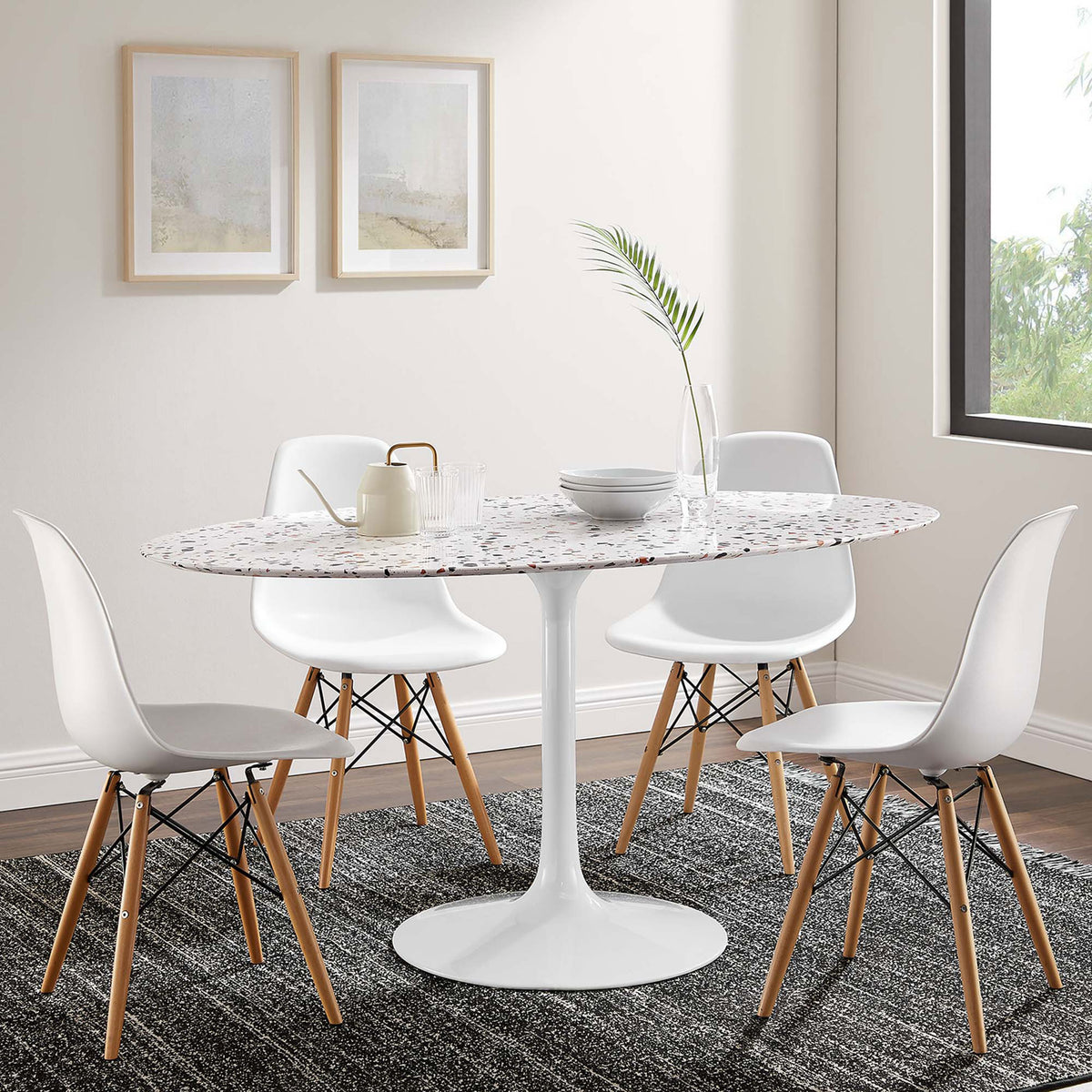 Terrazzo pedestal dining table paired with white chairs, creating an inviting mid-century dining area || EEI-5734-WHI-WHI || front_angle_room