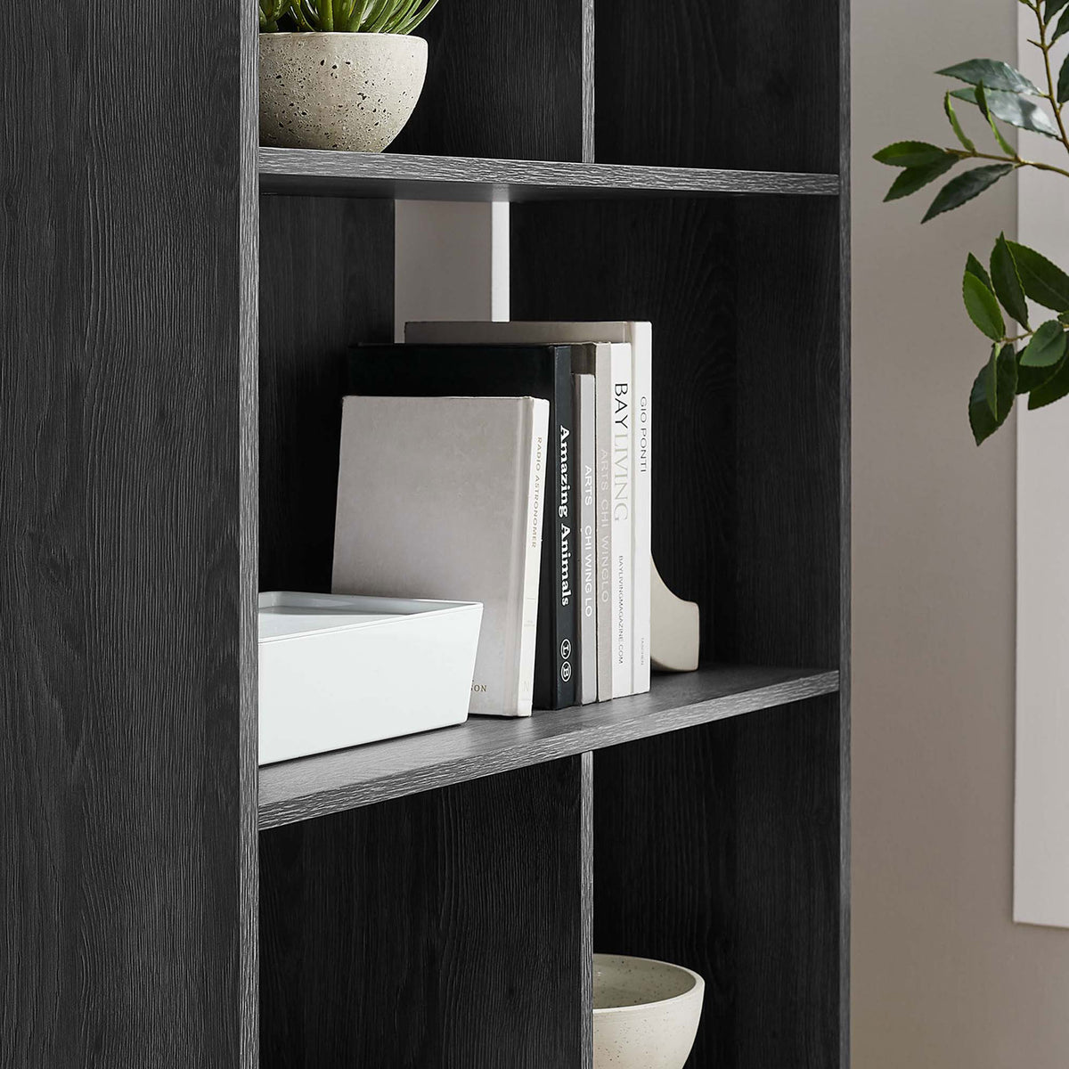Styled shelves showcase books and decor with a sleek charcoal finish and clean lines. || EEI-5743-CHA || detail_room