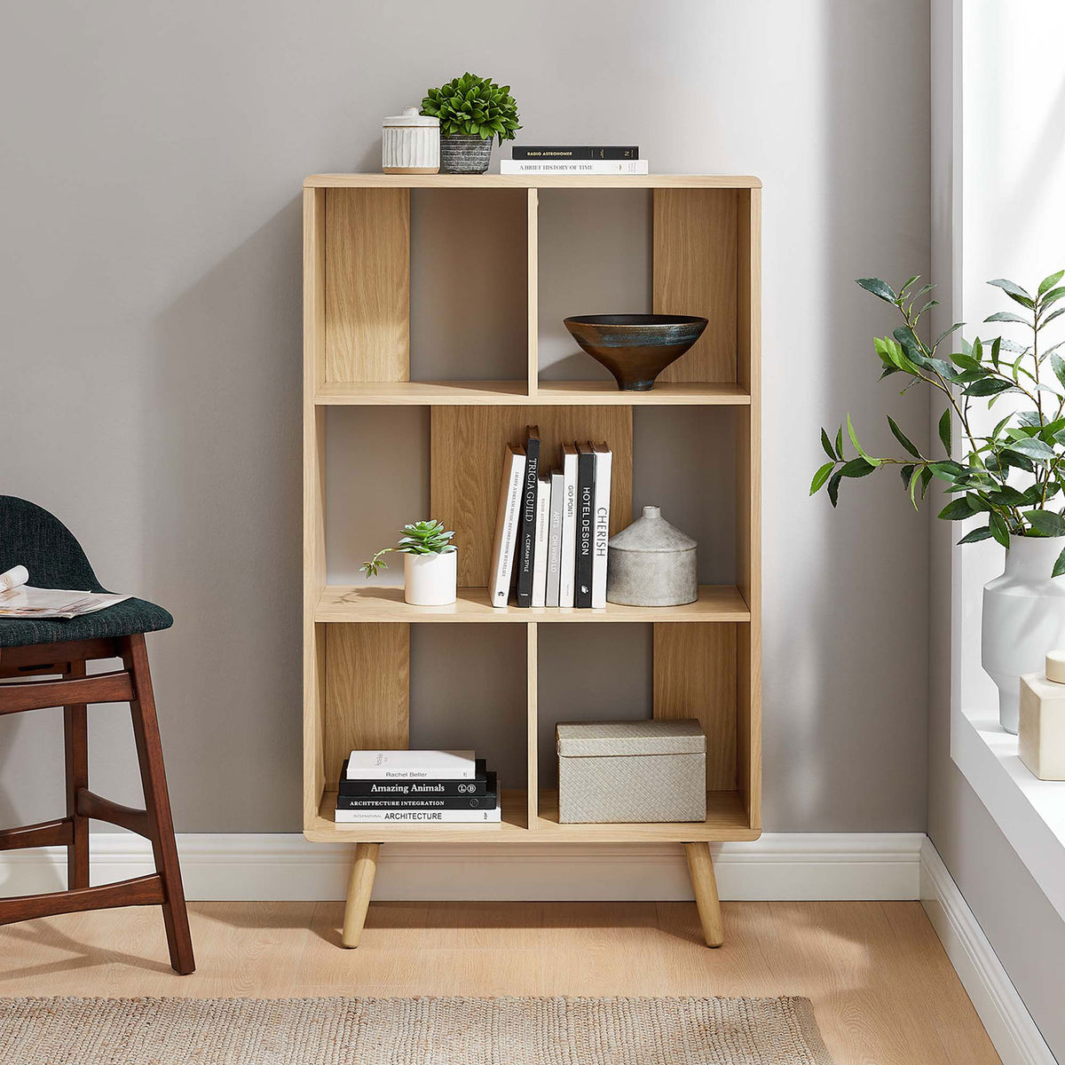 Oak bookcase styled in a bright living space for books, accents, and collectibles || EEI-5743-OAK || front_room